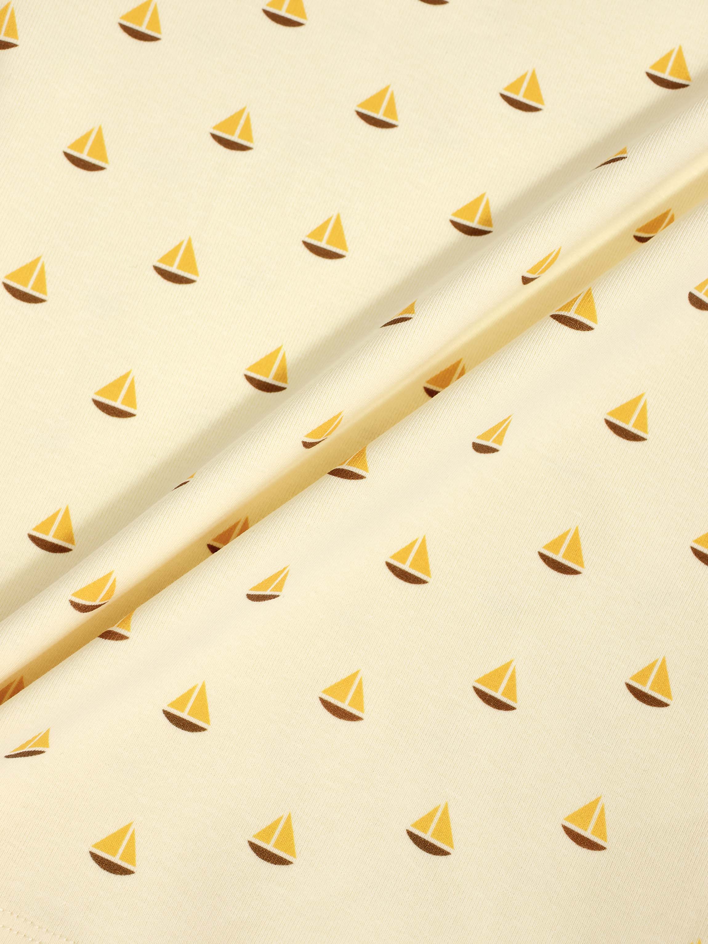 Boat Print Set fabric for little boys by Adee; pale yellow with small yellow sailboats pattern.