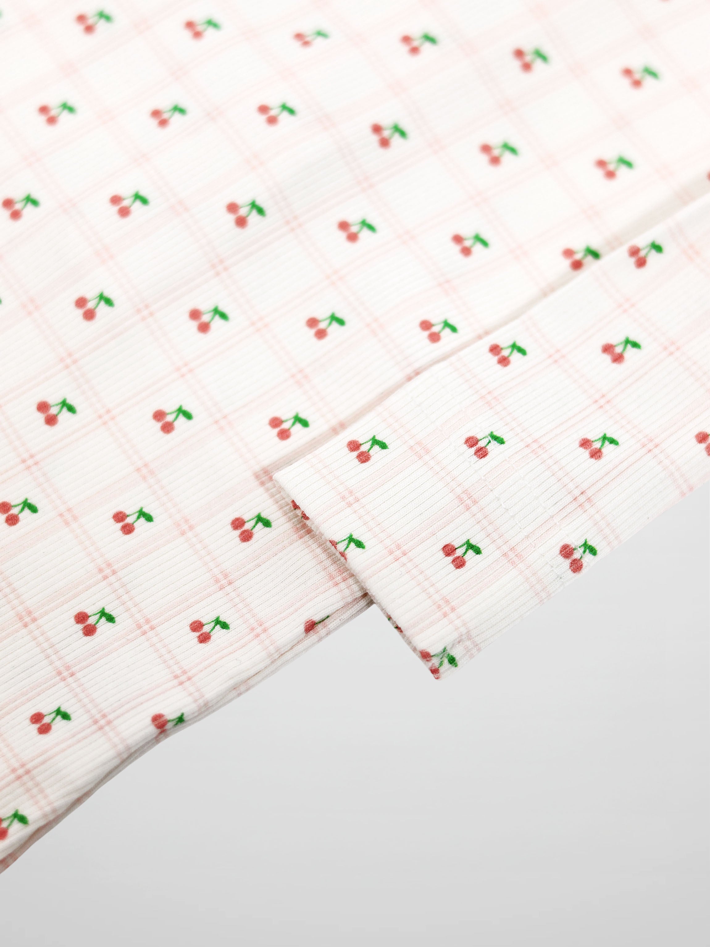 Cherry Window Stretchy; pink cherry-print fabric for Girls Stretchies.