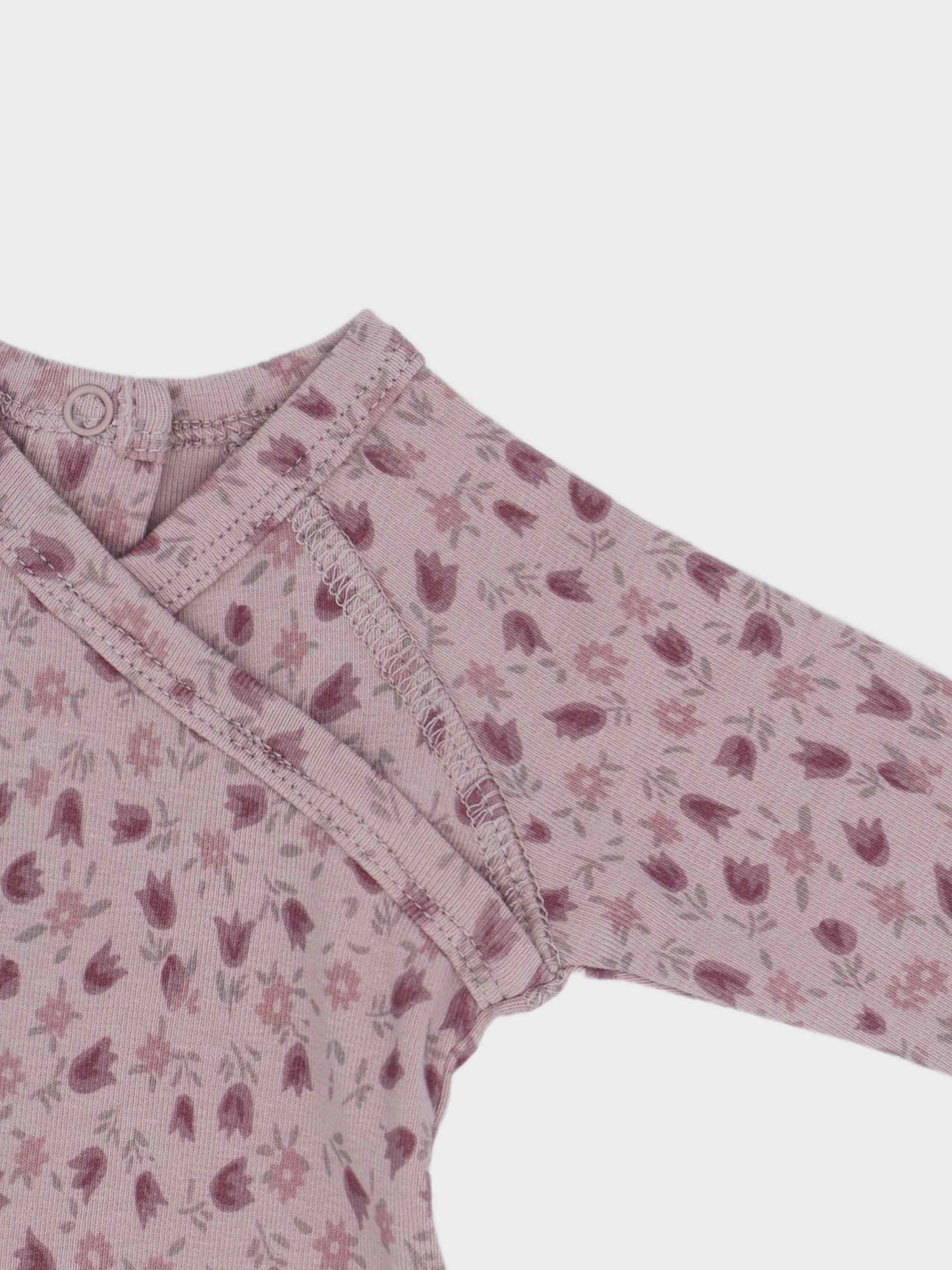 Baby jumpsuit with pink tulip pattern