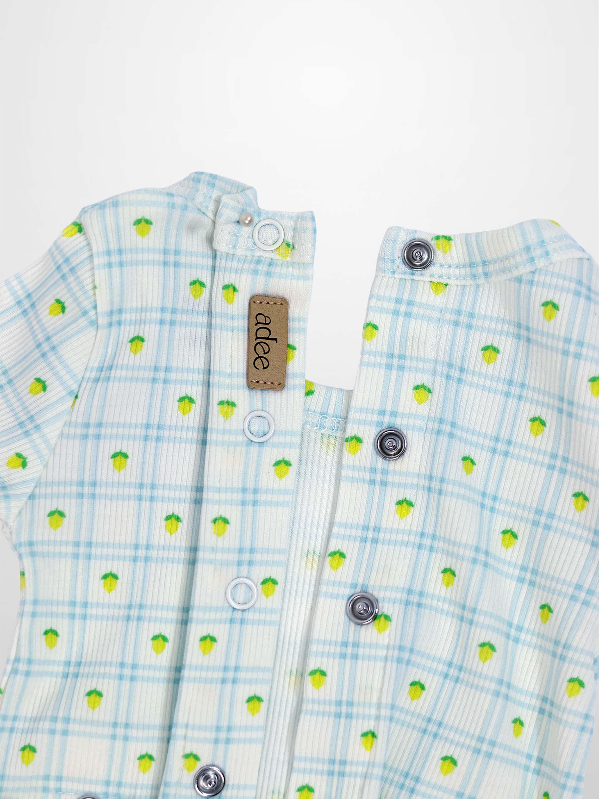 Lemon Window Stretchy boys stretchies in light blue plaid with yellow lemon prints, Adee brand, front snap buttons.