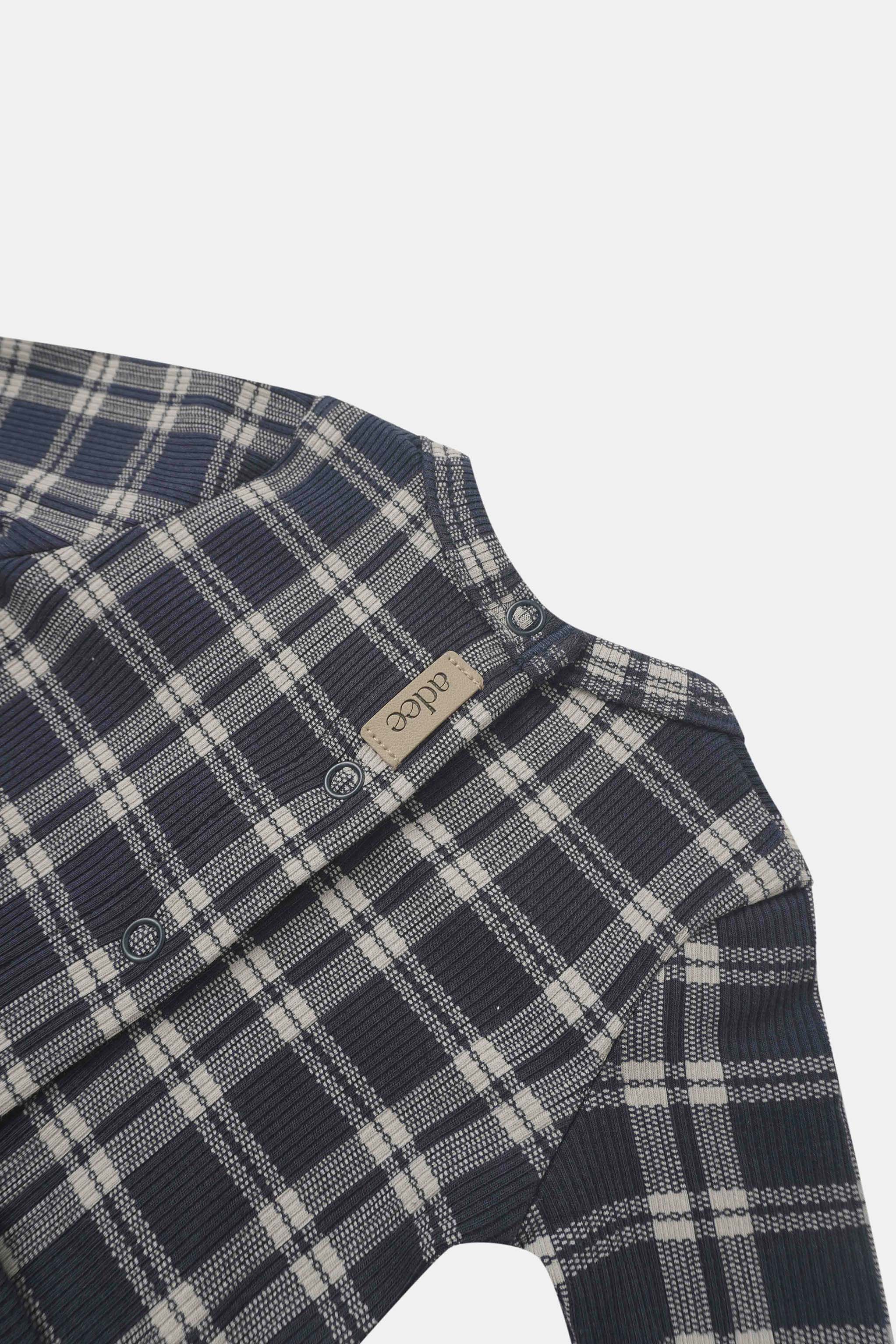 Navy plaid layette set for boys by Adee with snap closures.