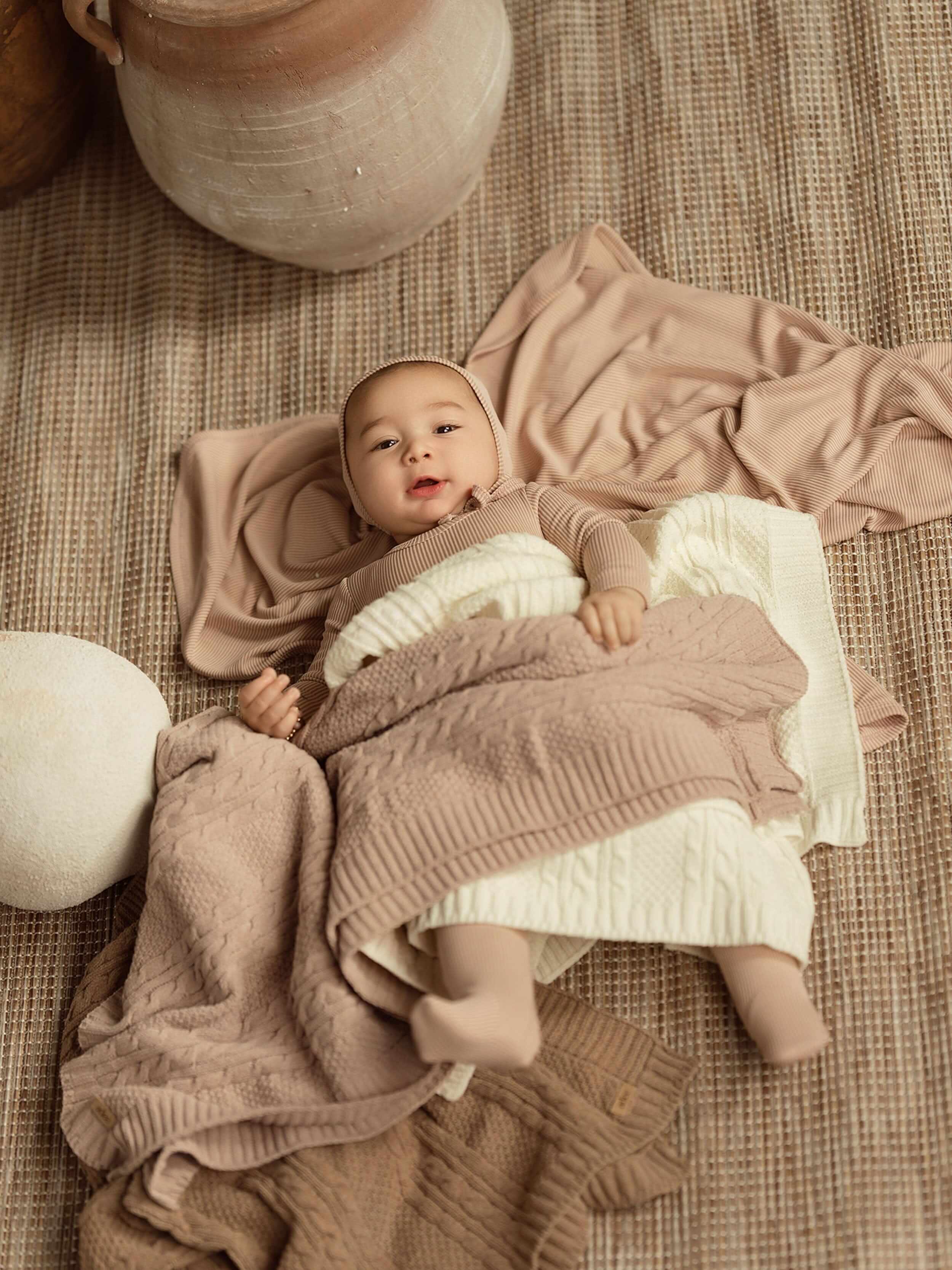 pink knit baby blanket keeping these girl warm