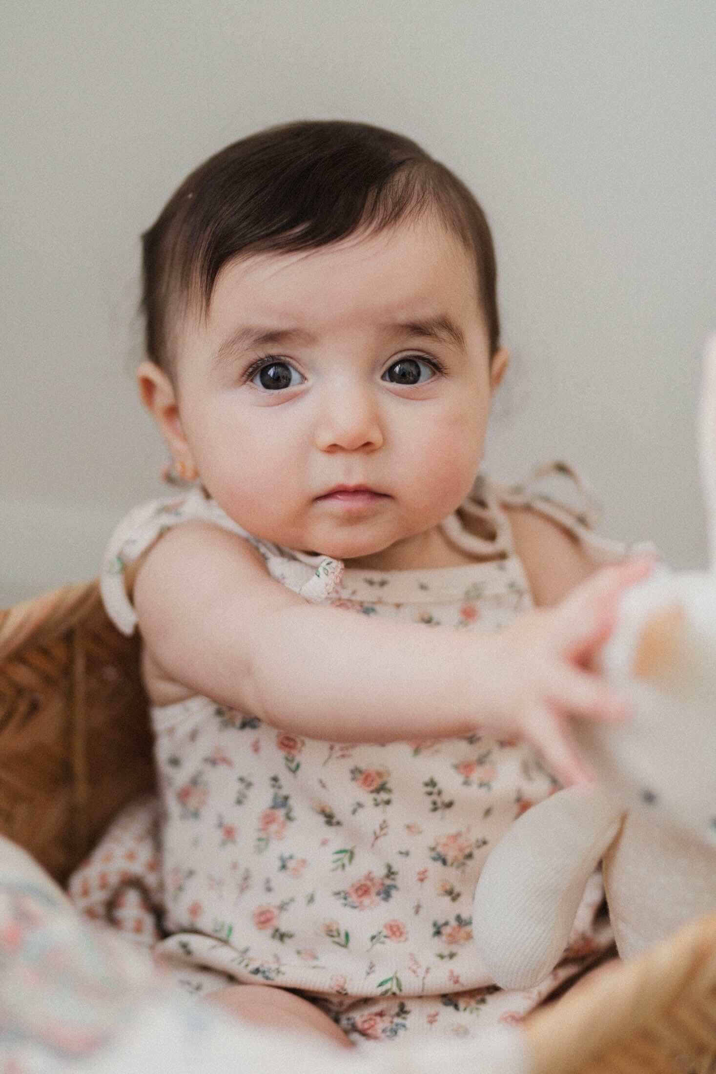 Adorable baby girl in floral romper