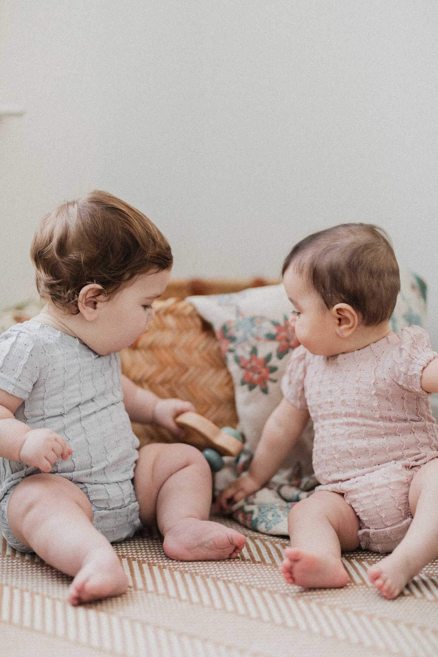 Cute babies in ruffled rompers.