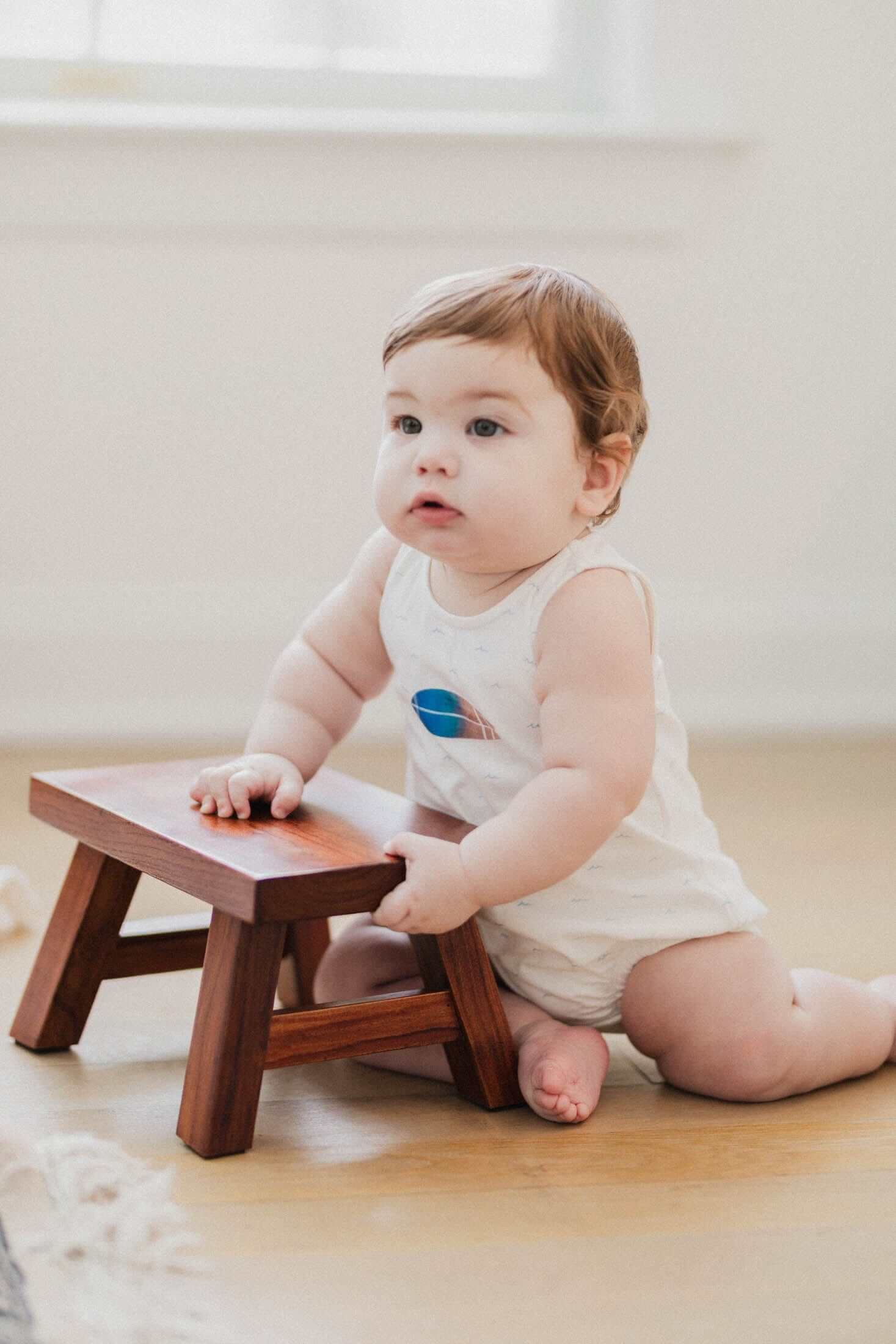 Baby boy in surf romper