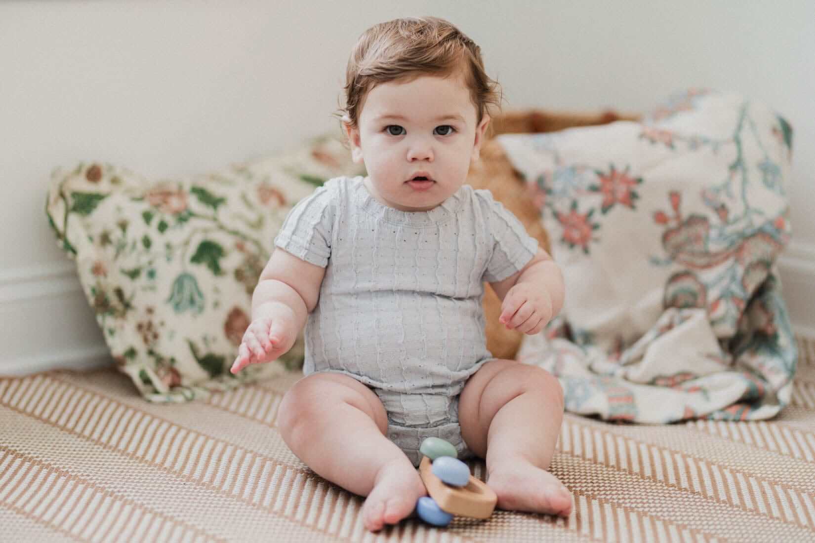 Baby boy in light blue romper