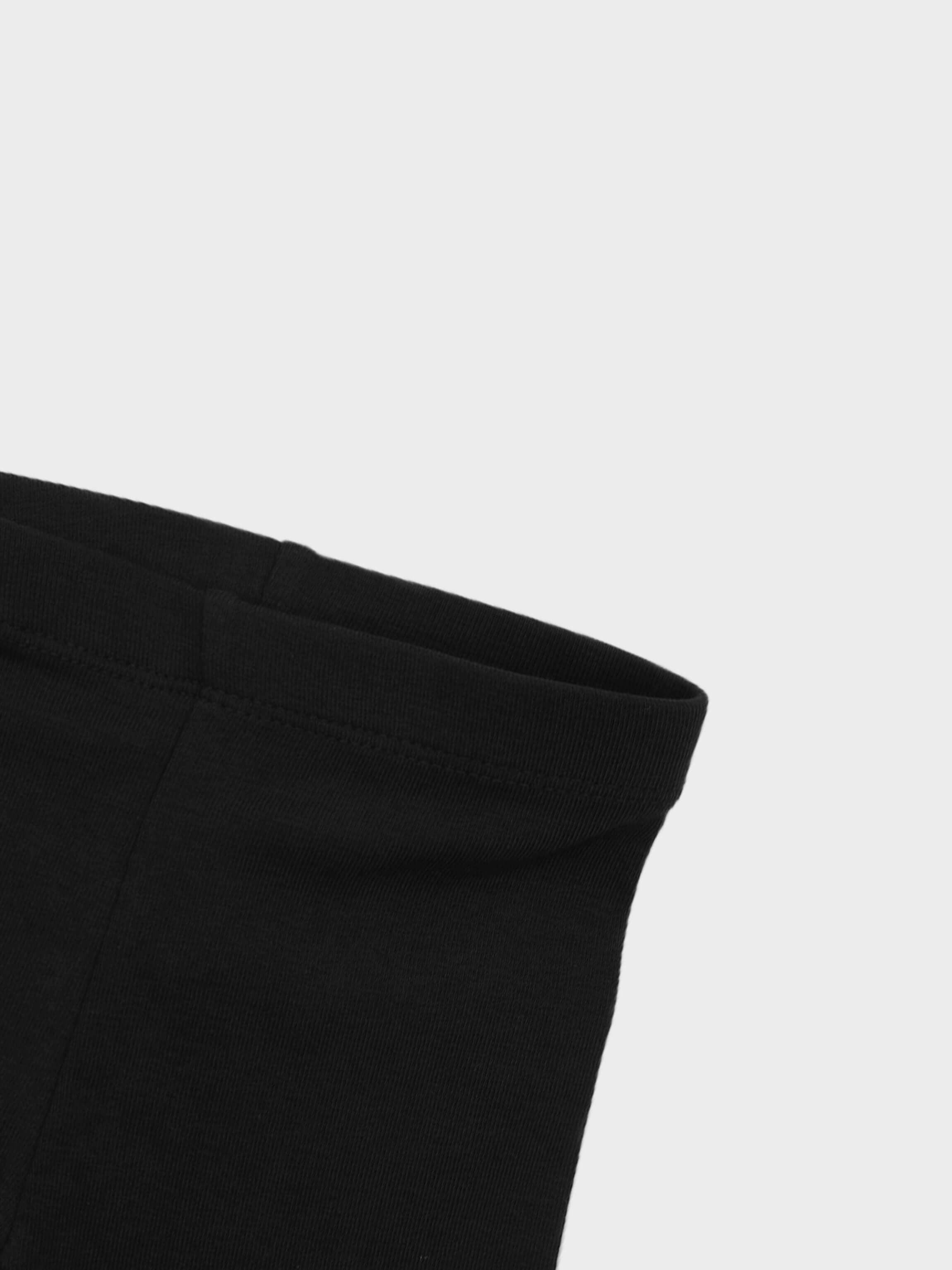Close-up of black leggings waistband