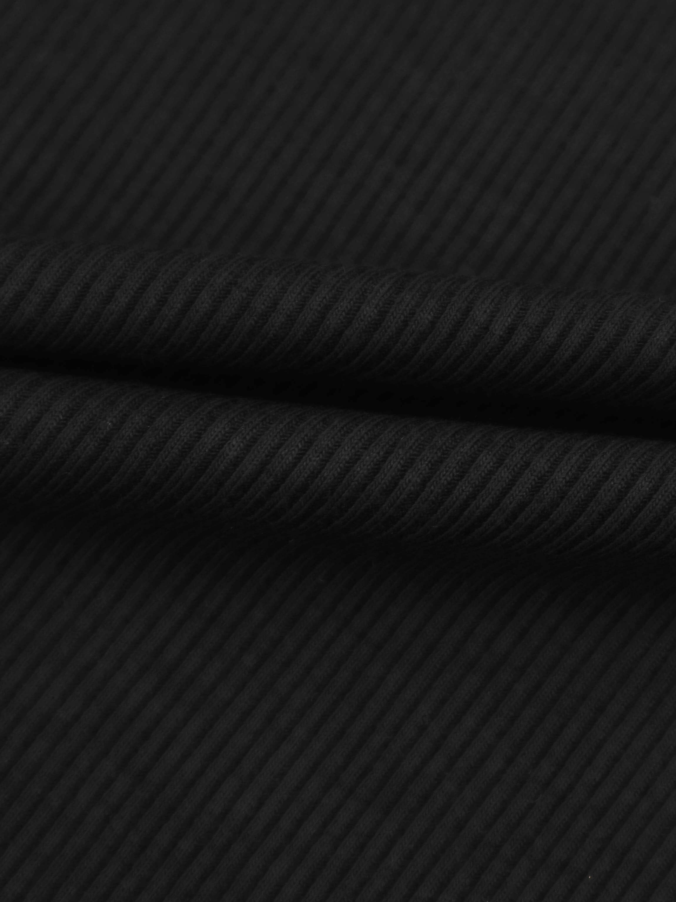 Soft ribbed black fabric close-up