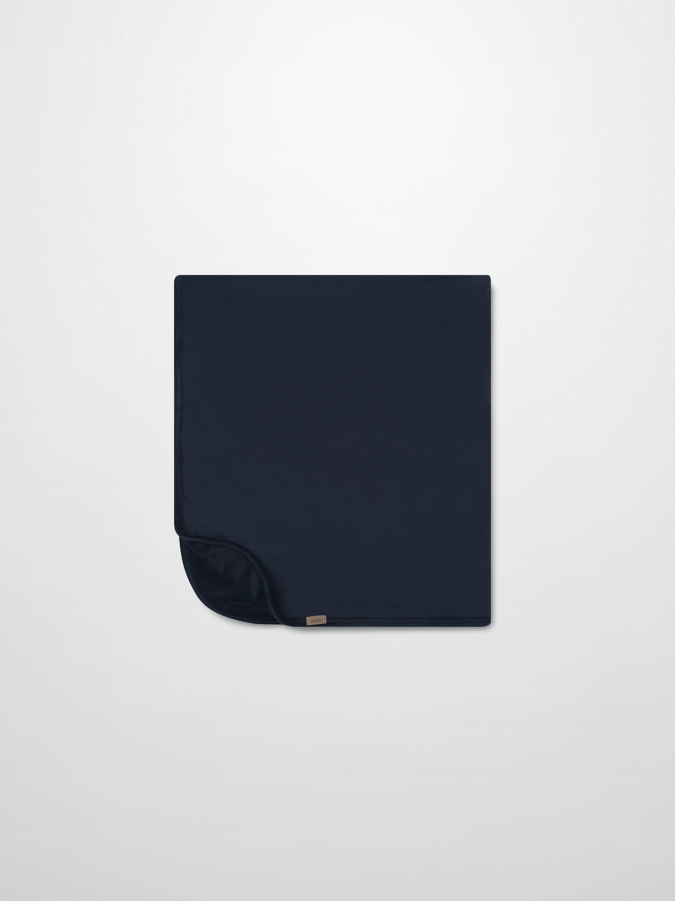 Embroidered Bear Blanket - Navy by Adee; navy boys swaddle blanket with a small corner tag.