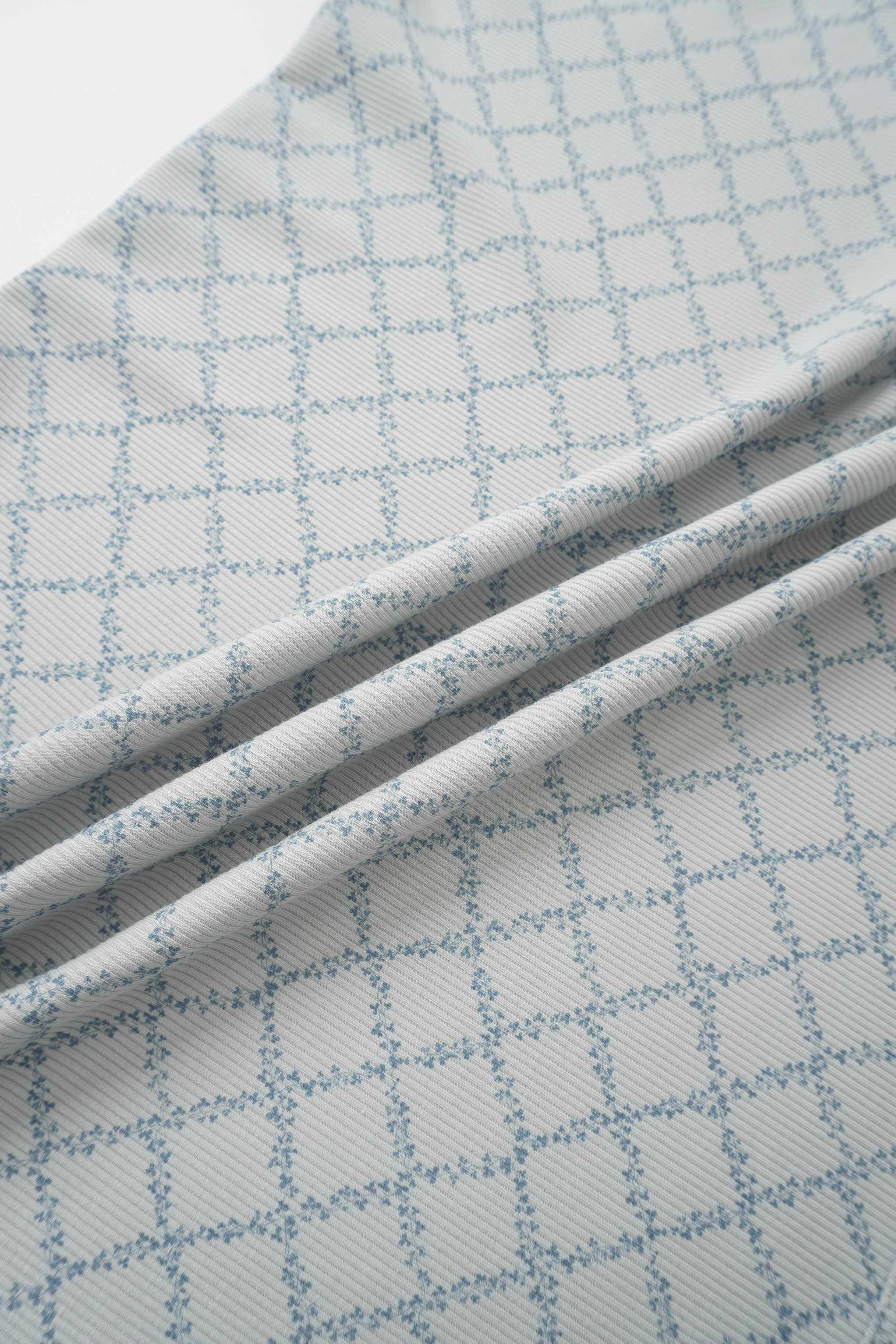Blue Leaf Blanket swaddle blanket for boys by Adee in a light blue grid pattern