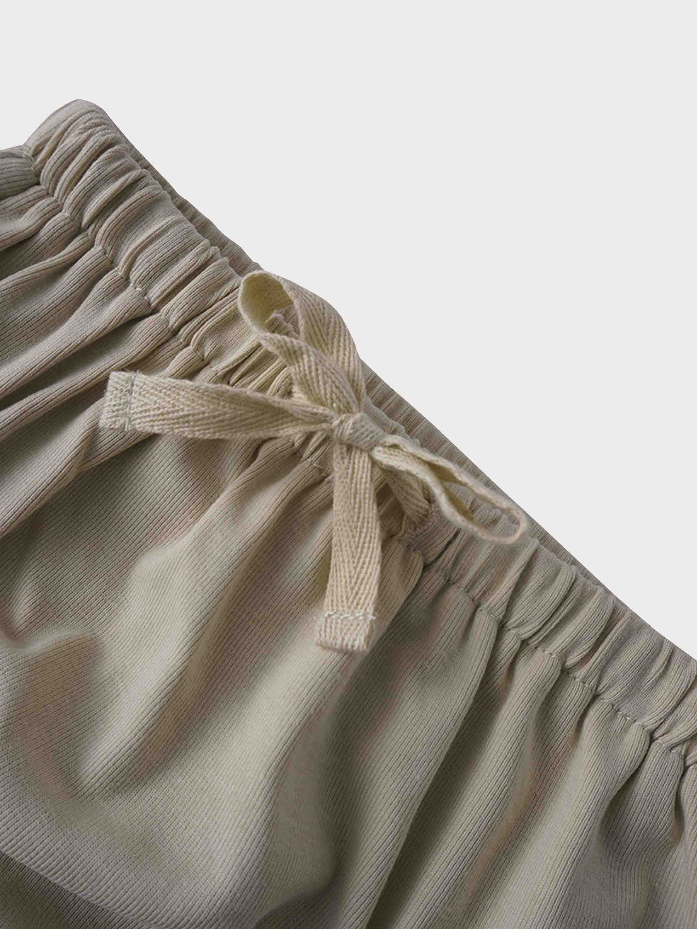 Light tan drawstring bloomer close-up