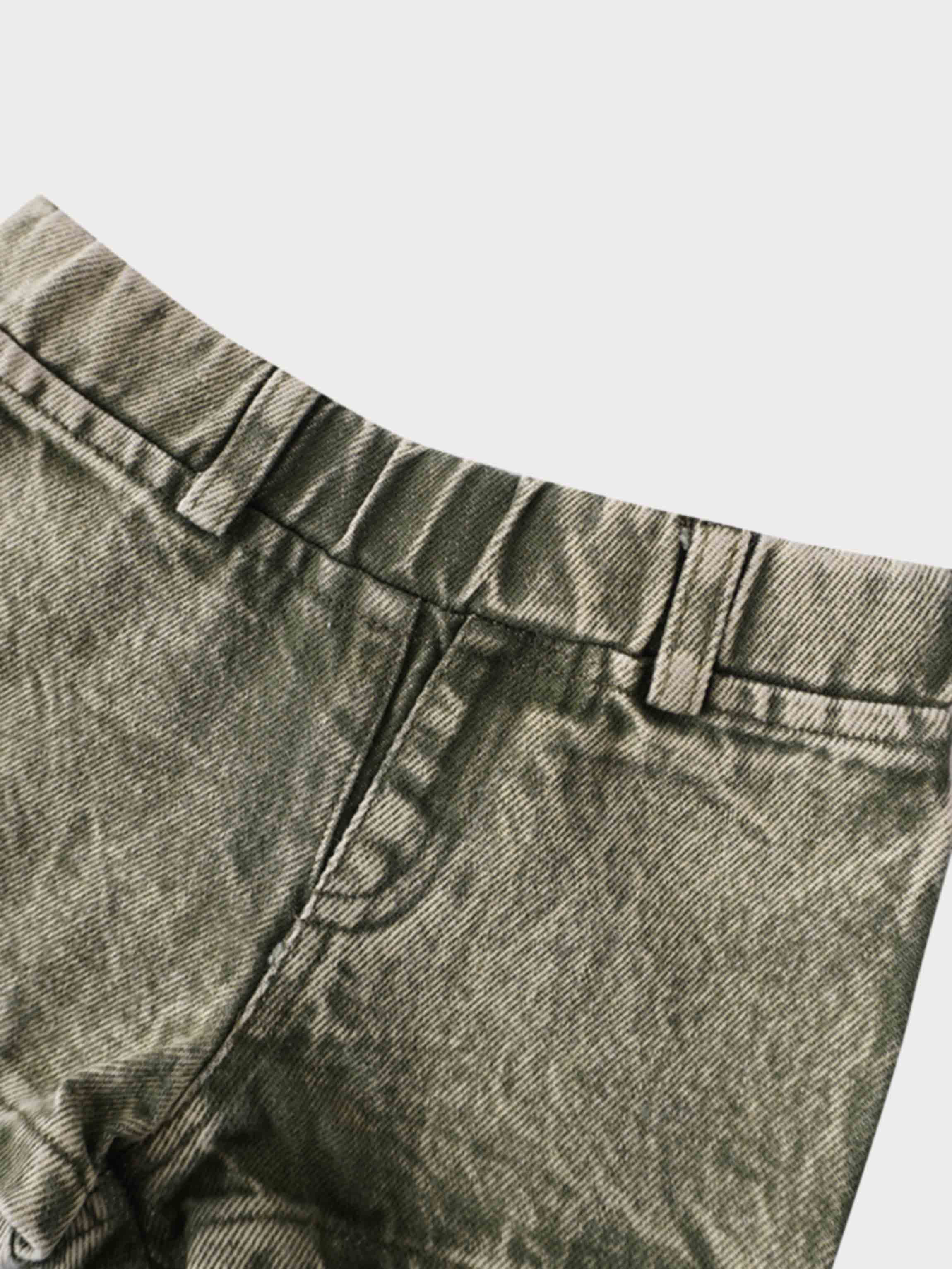 Washed green denim shorts waistband