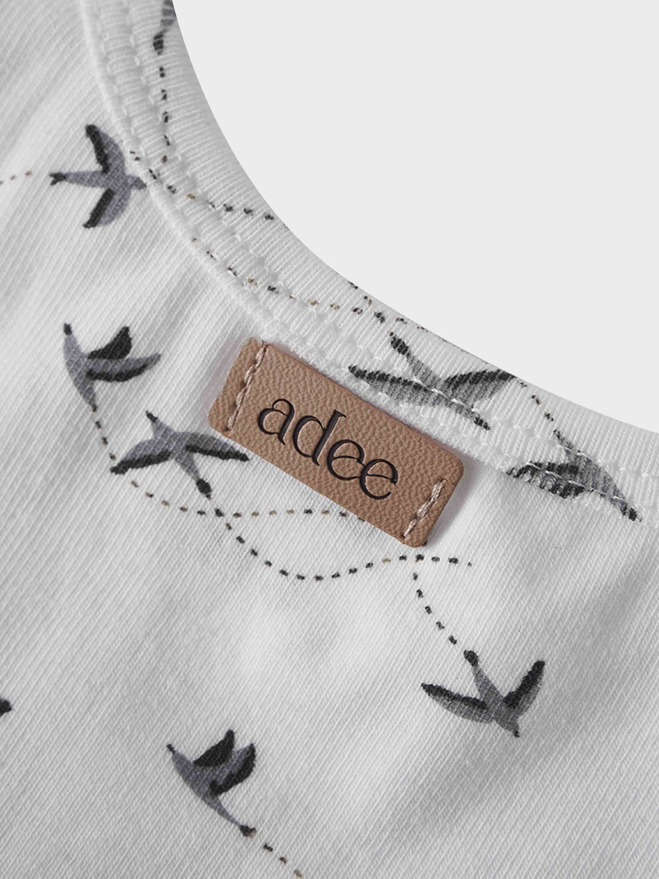 Grey swallows on girls t-shirt