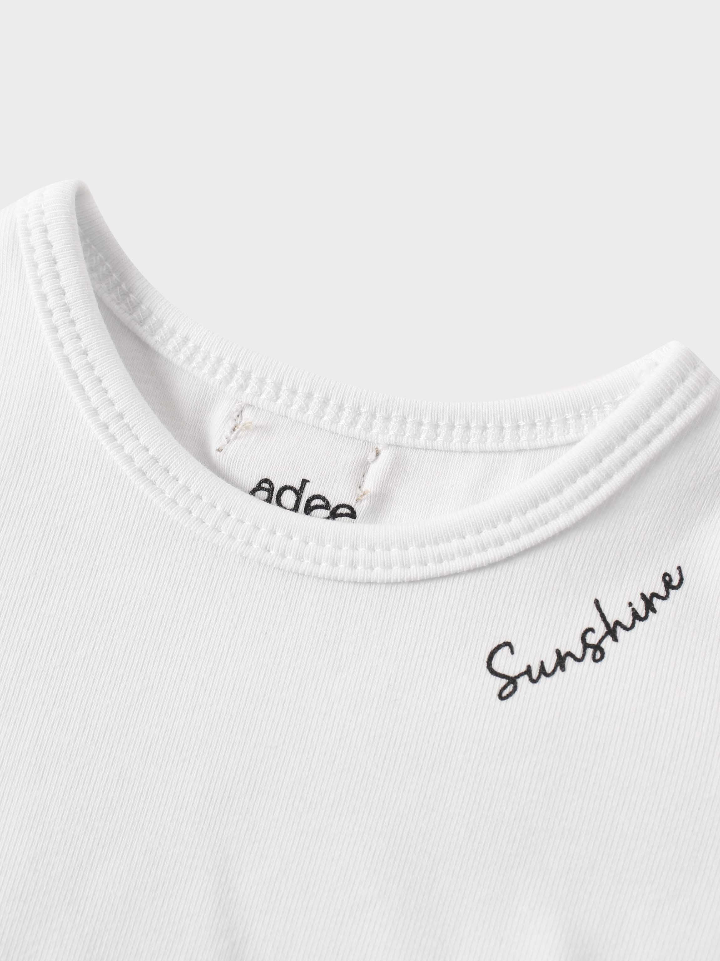 Close-up of white boxy tee