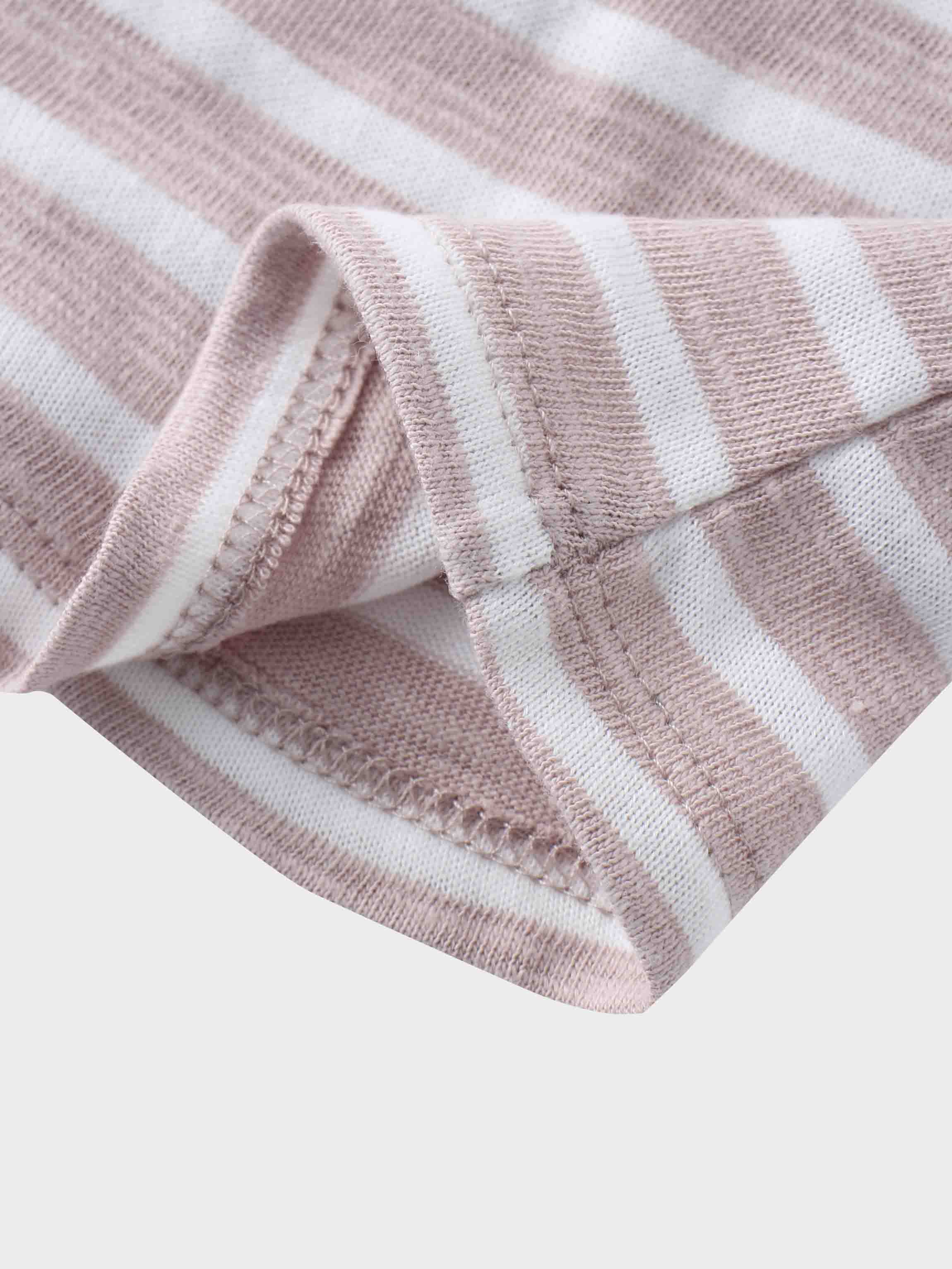 Pastel pink striped fabric close-up