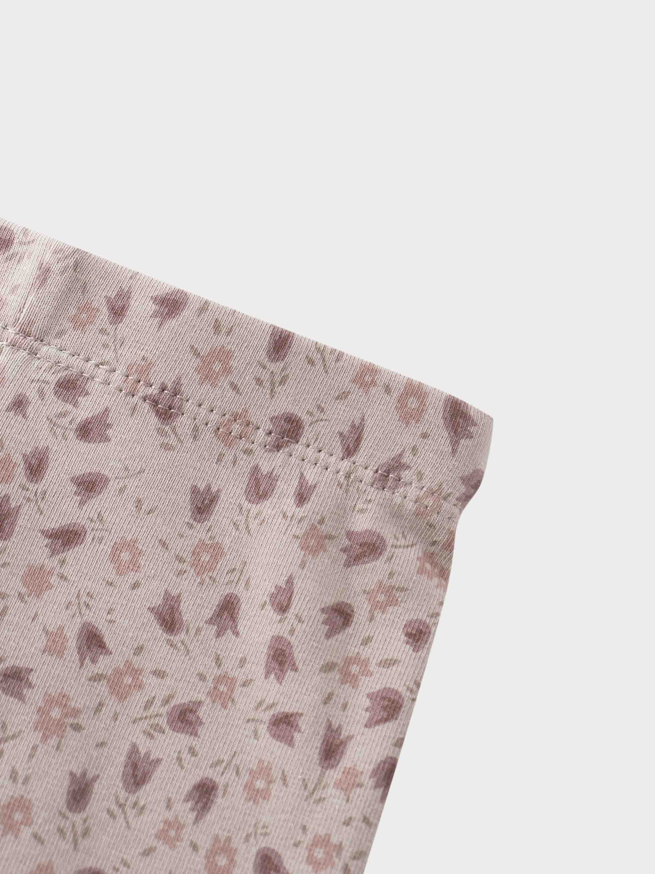 Purple tulip print fabric close-up
