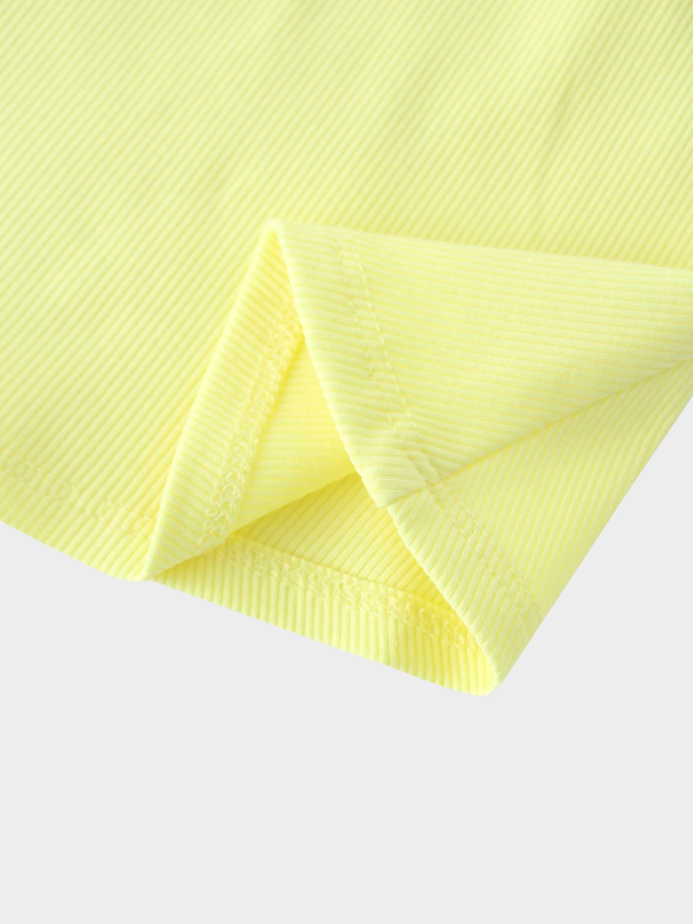Close-up of yellow ribbed fabric, girls&