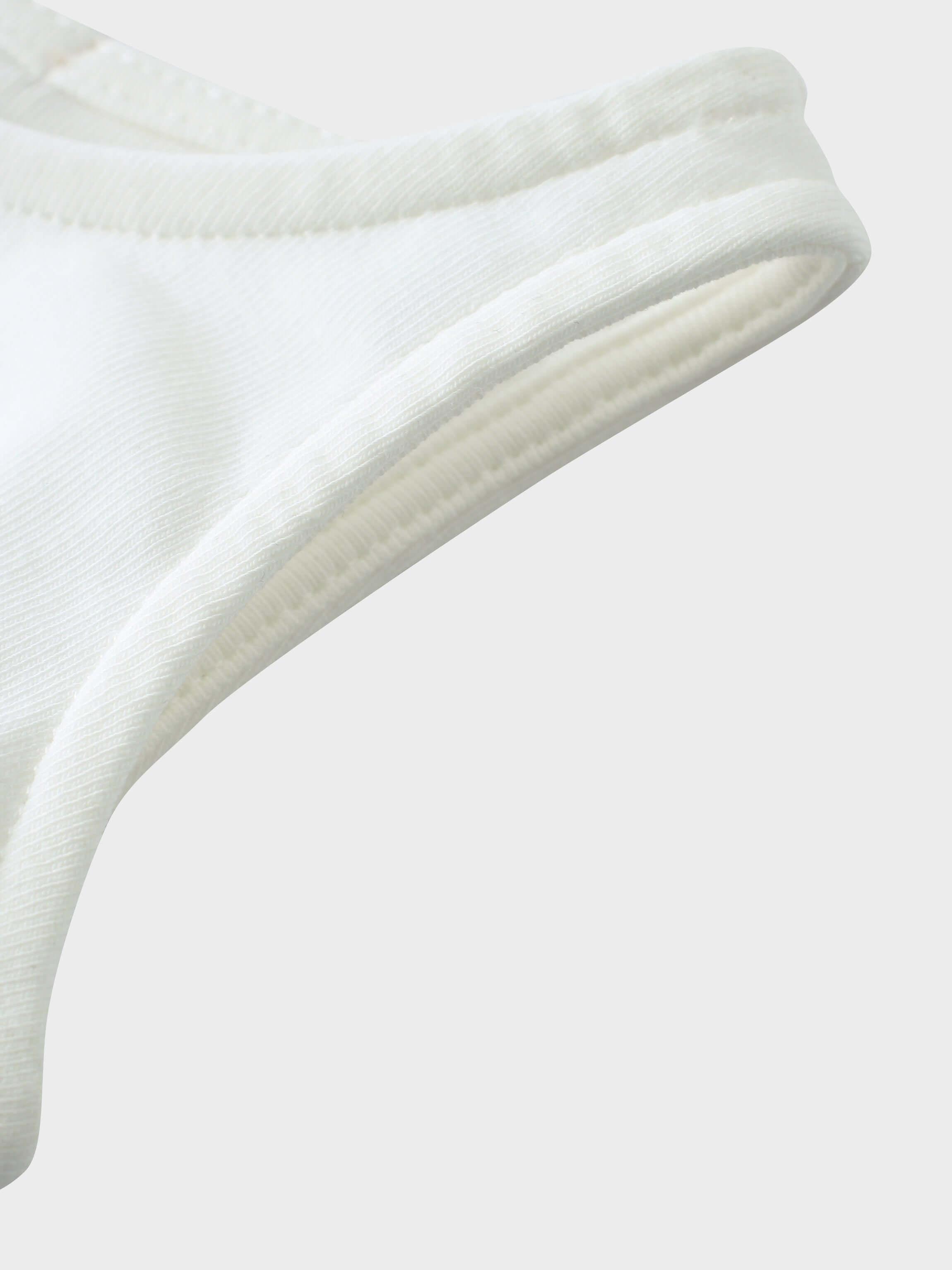 White baby romper shoulder strap