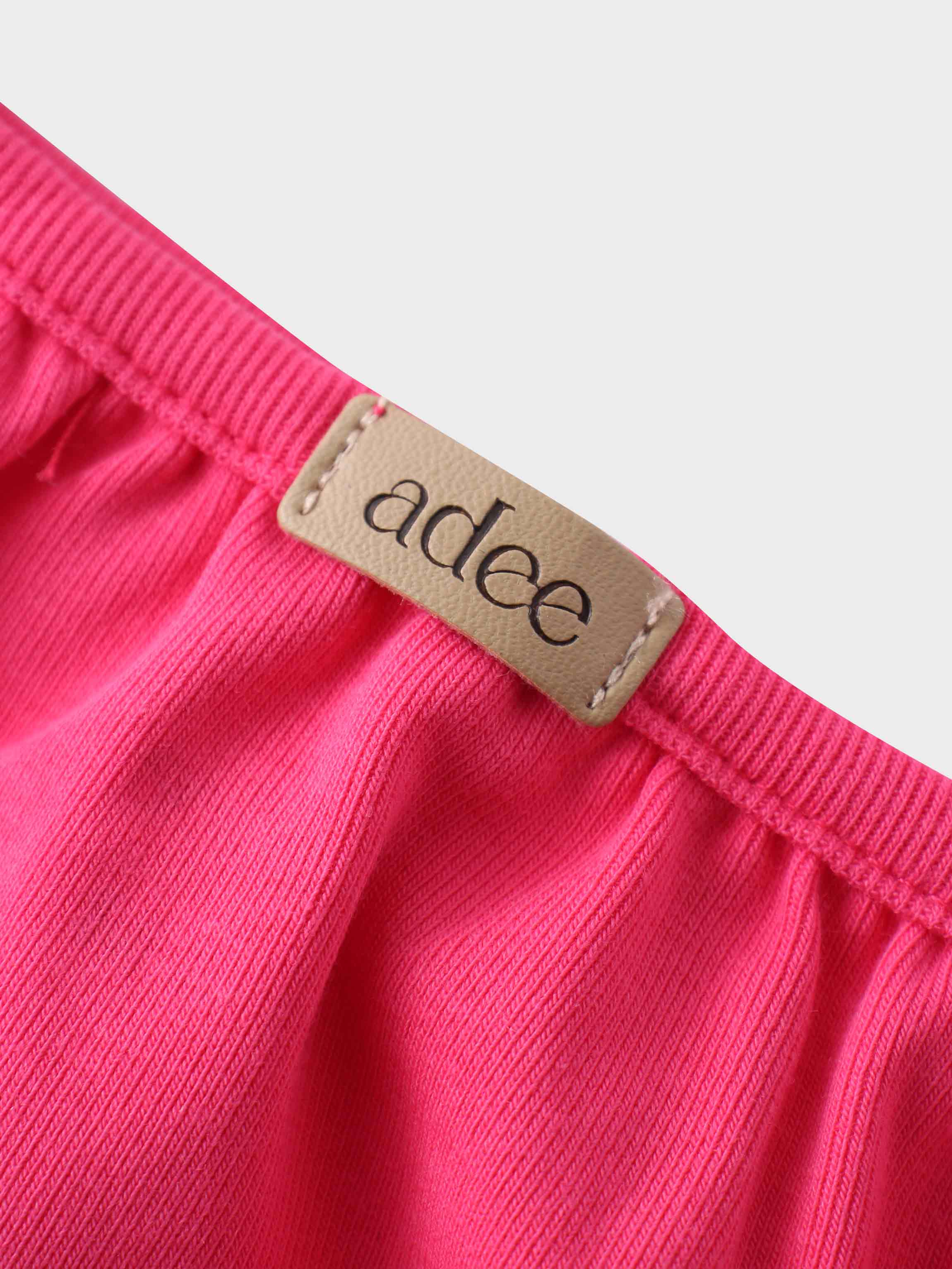 Hot pink baby romper detail