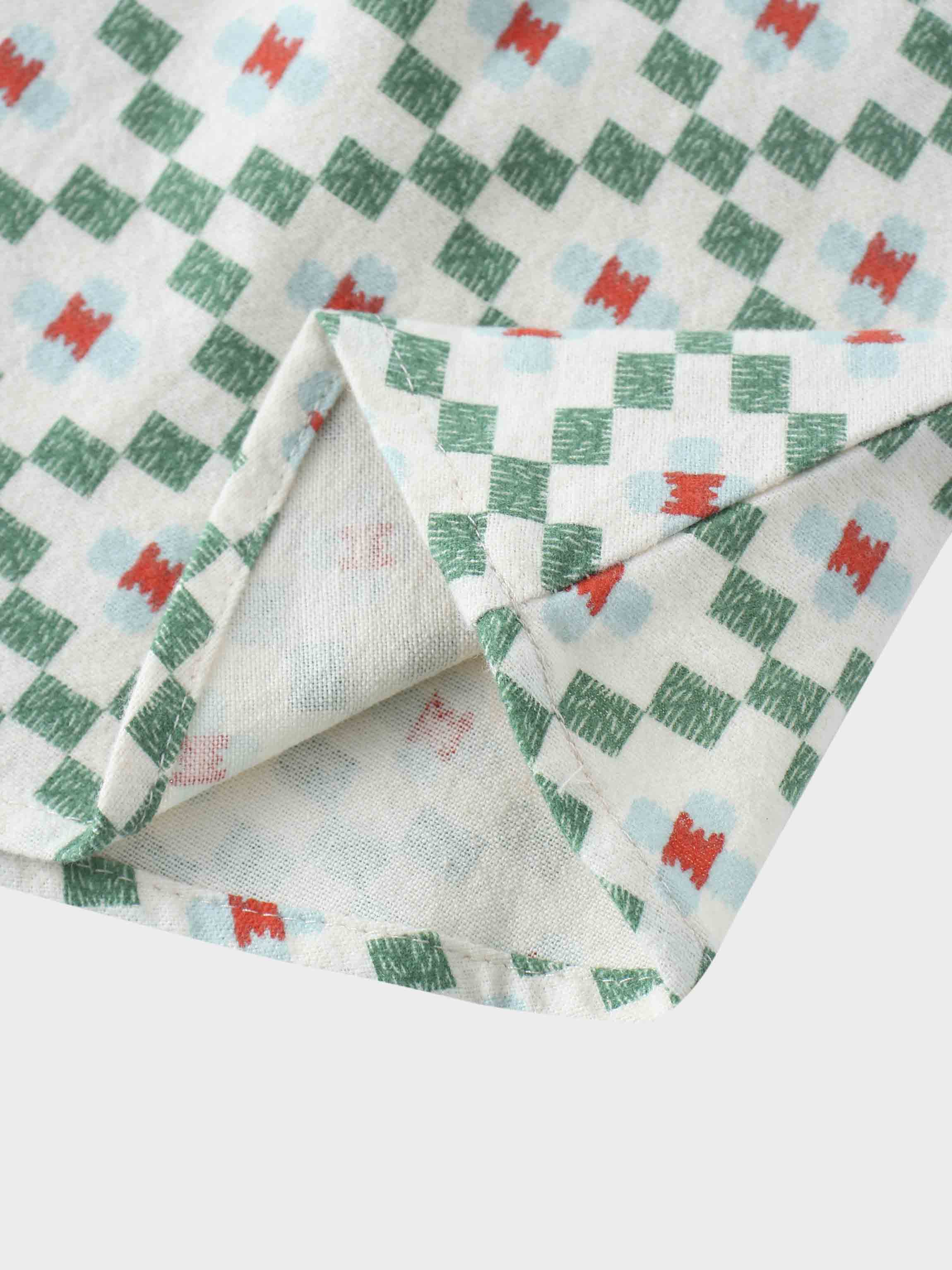 Green diamond pattern fabric close-up