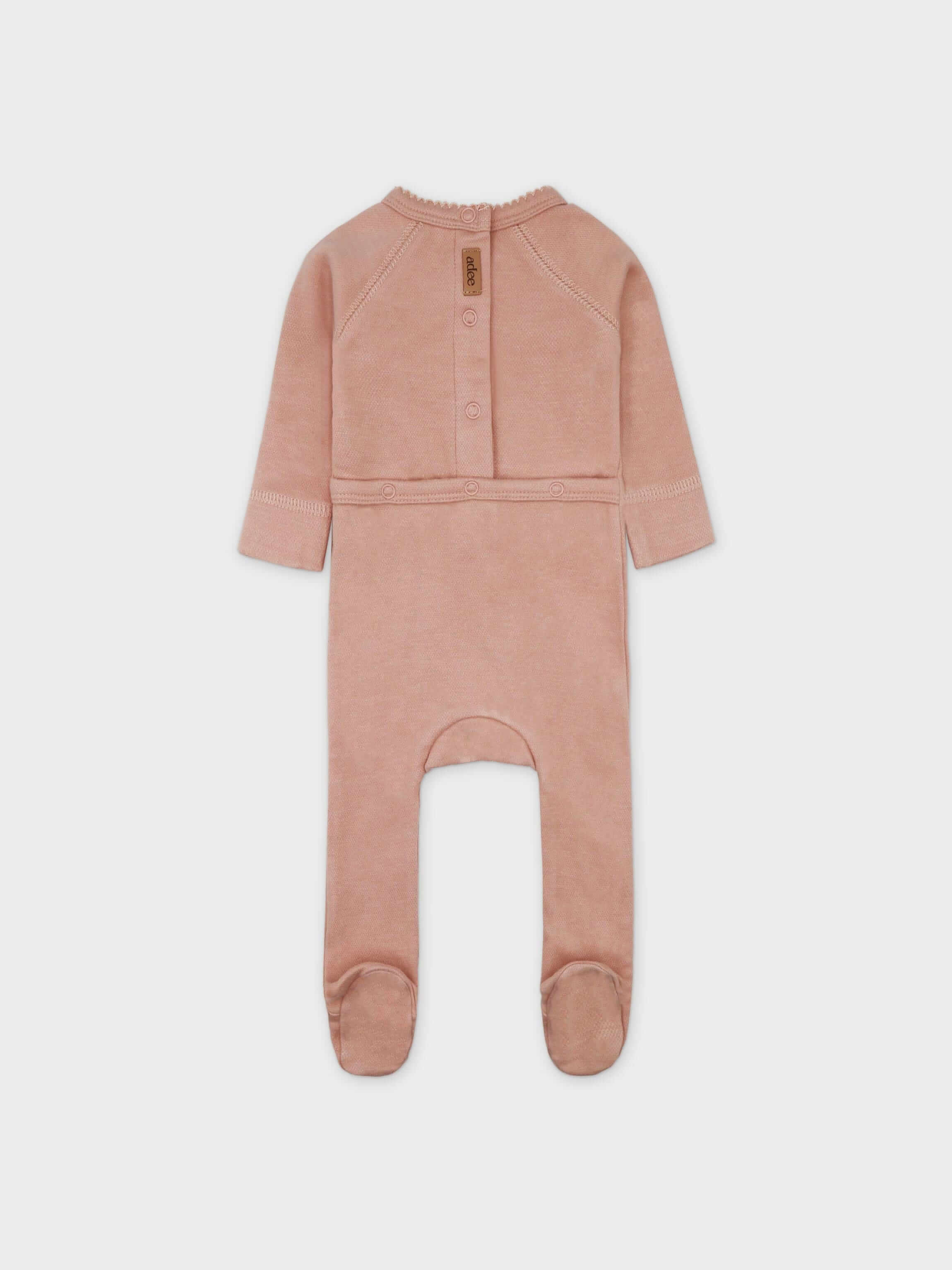 Pink Adee girls stretch jumpsuit, footed design with back snaps; brand tag visible.