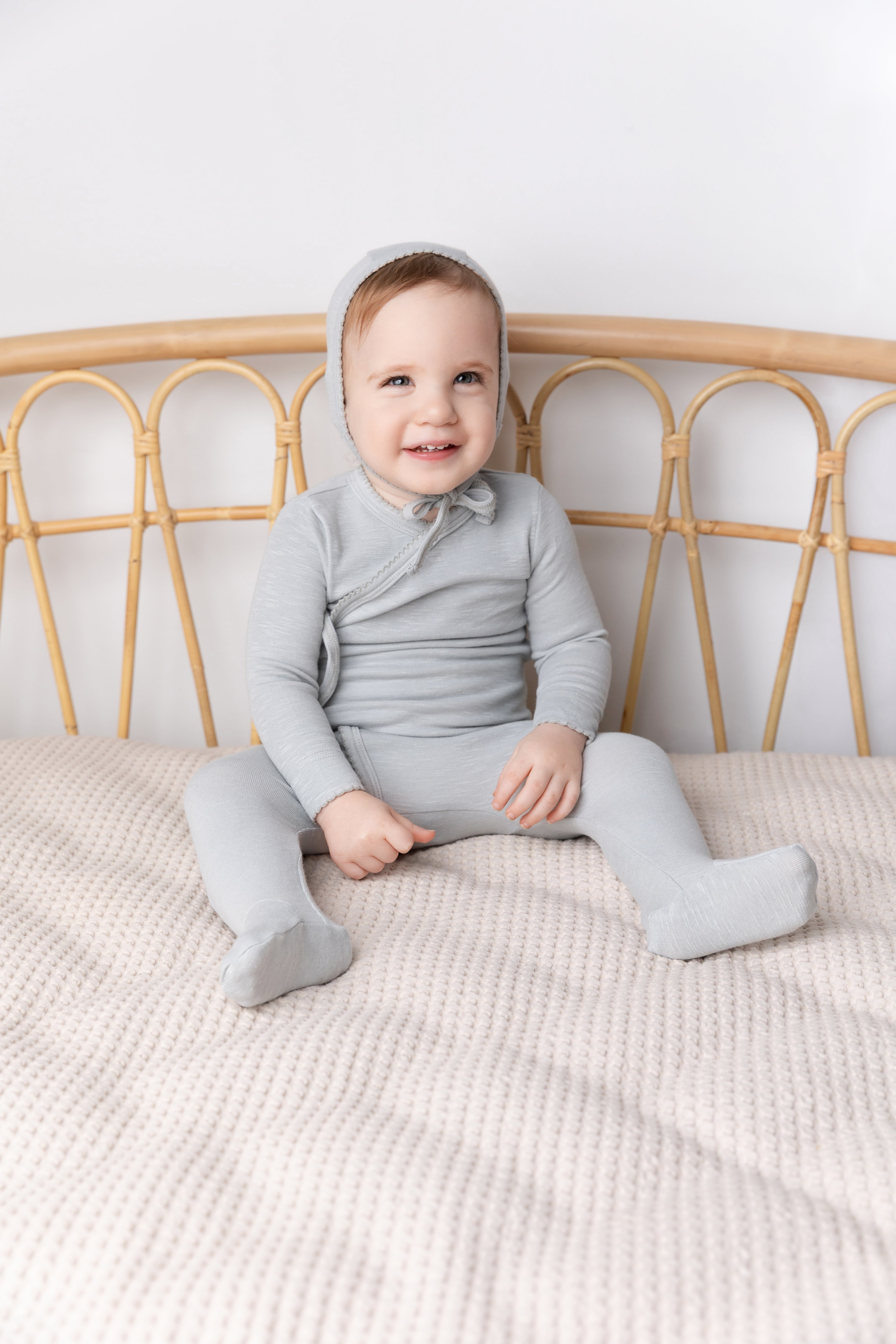 Blue Scalloped Stretchy Boys Stretchies set in light blue knit, with a hooded top and matching pants