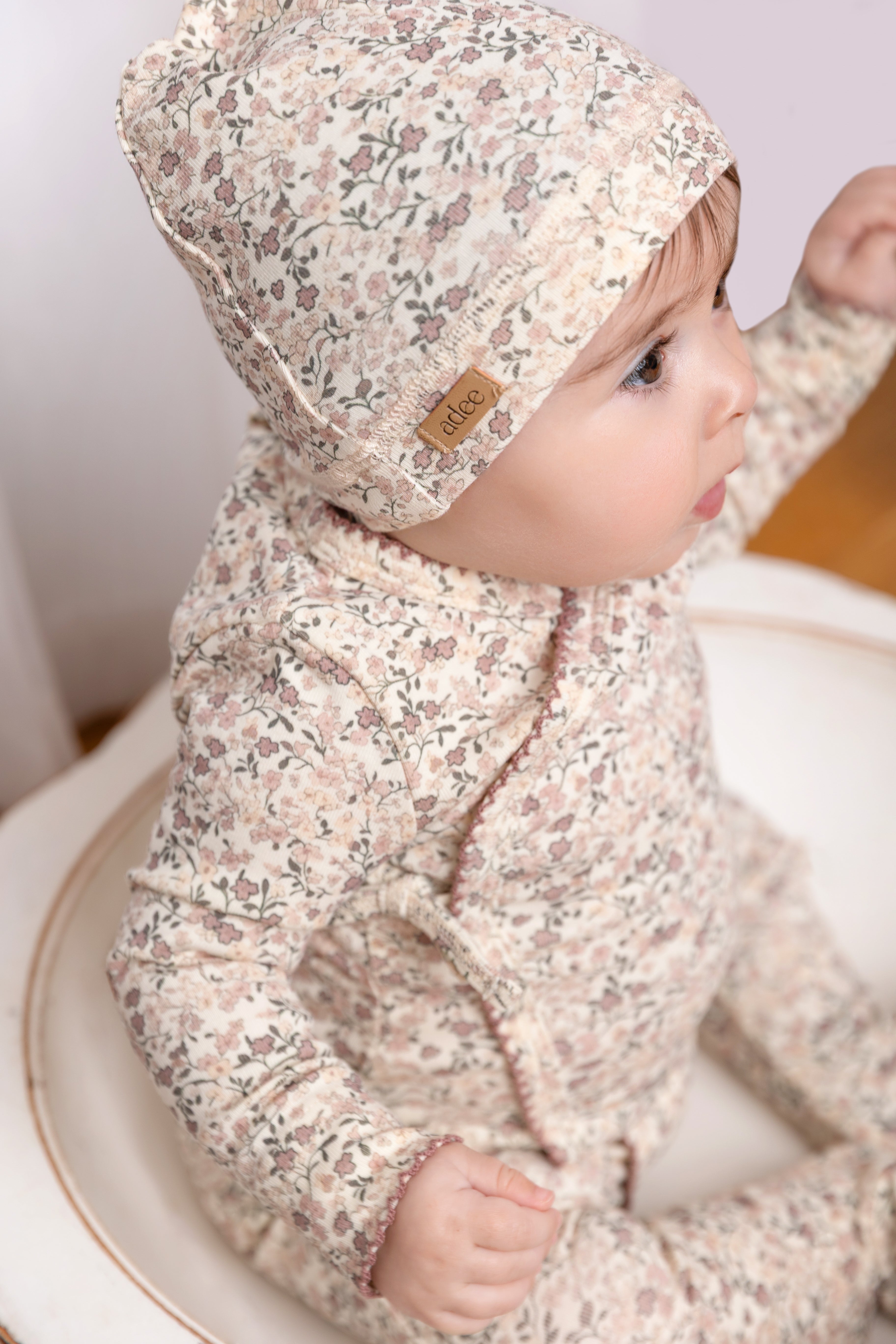 Purple Flower Stretchy by Adee; girls stretchies in an all-over floral print.
