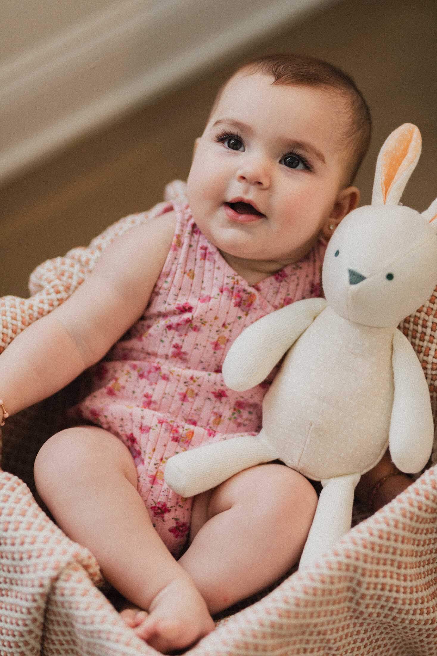 Baby girl in pink floral romper