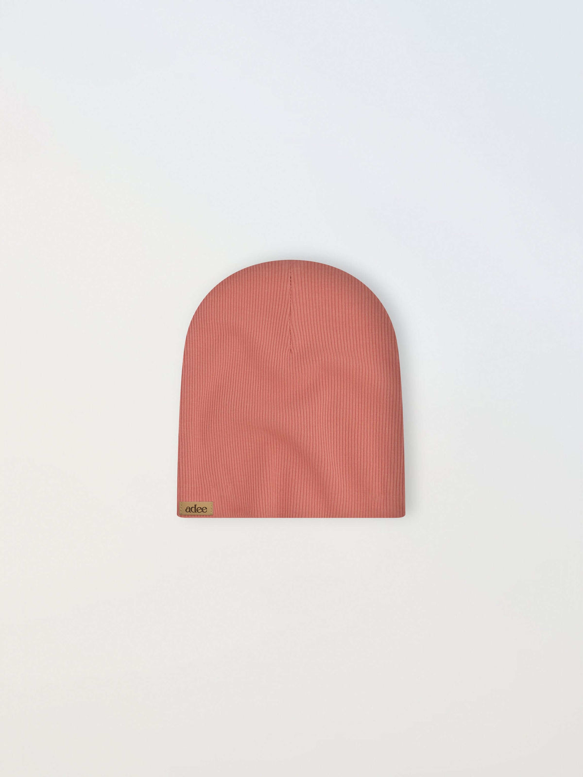 Thin ribbed pink girls beanie by Adee with a small beige tag.