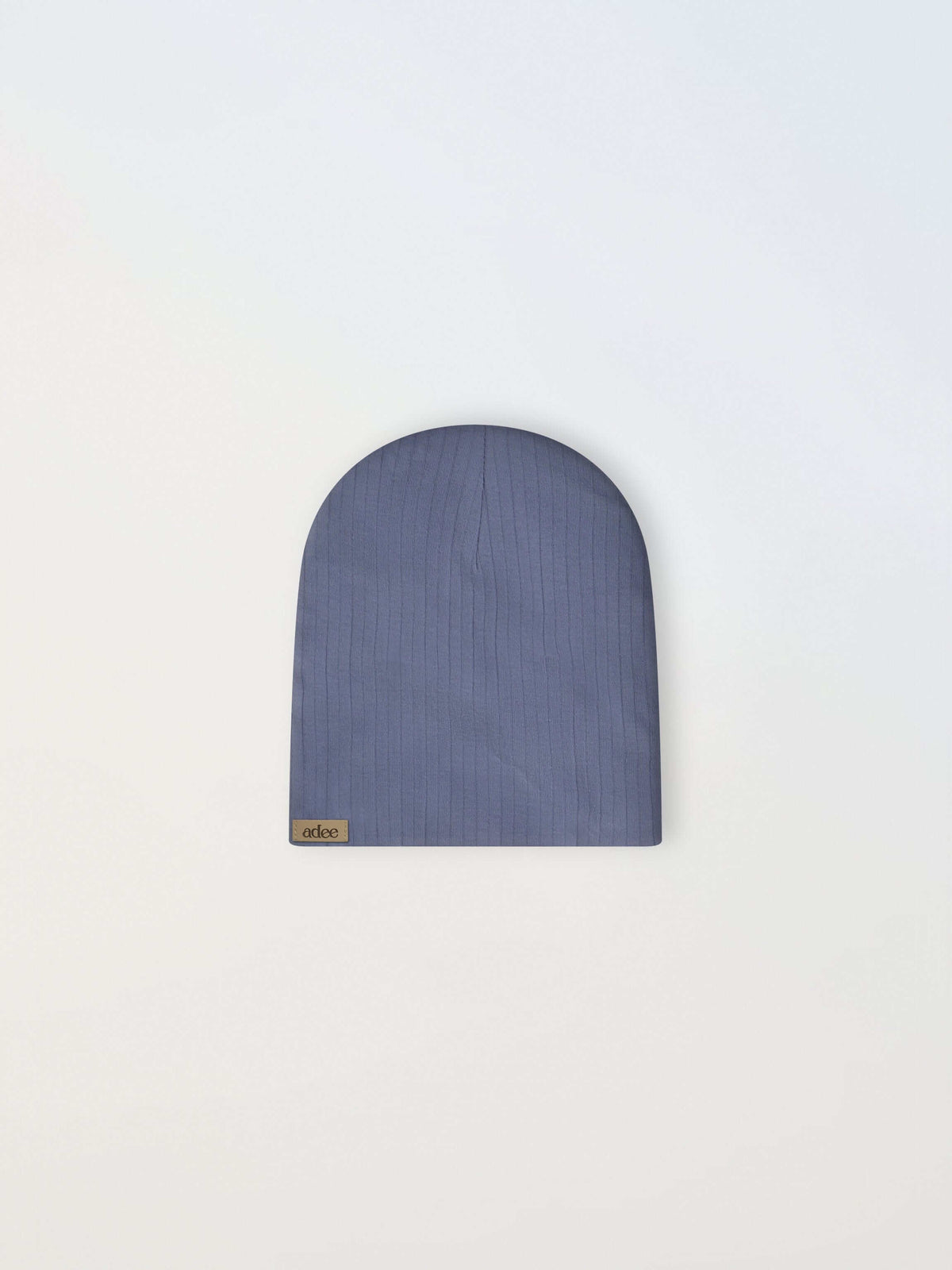 Blue wide-ribbed beanie with a small beige tag reading adee