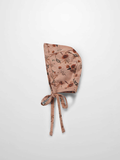 Pink baby bonnet hat for girls with string to tie safely 