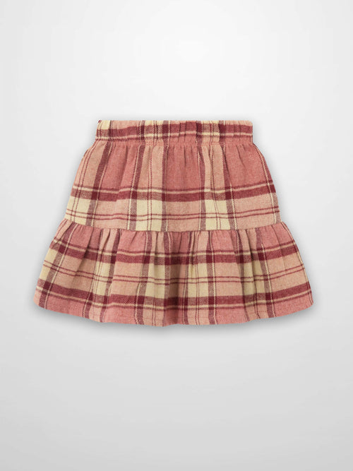 Girls plaid skirt in pink, cream, and deep red with elastic waist and two-tier ruffle.