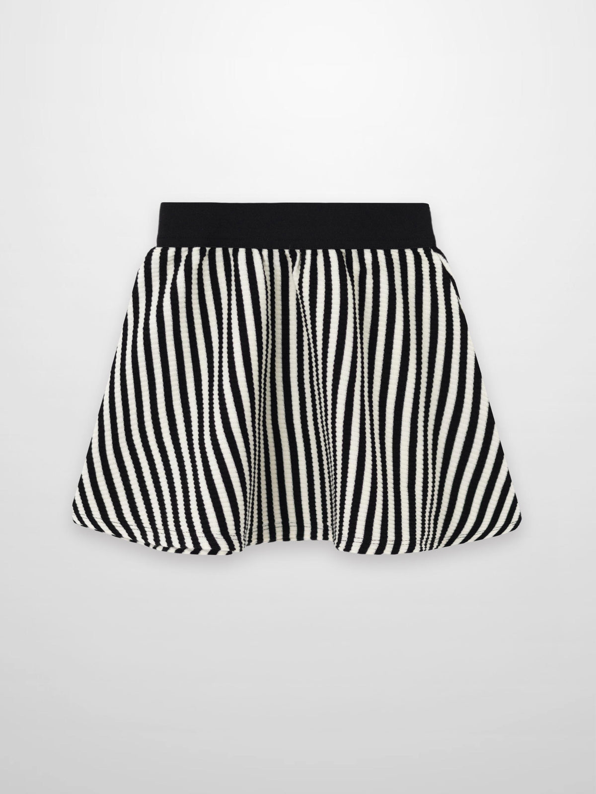 Striped black-and-white circle skirt for girls with a wide black elastic waistband and textured ribbed fabric.