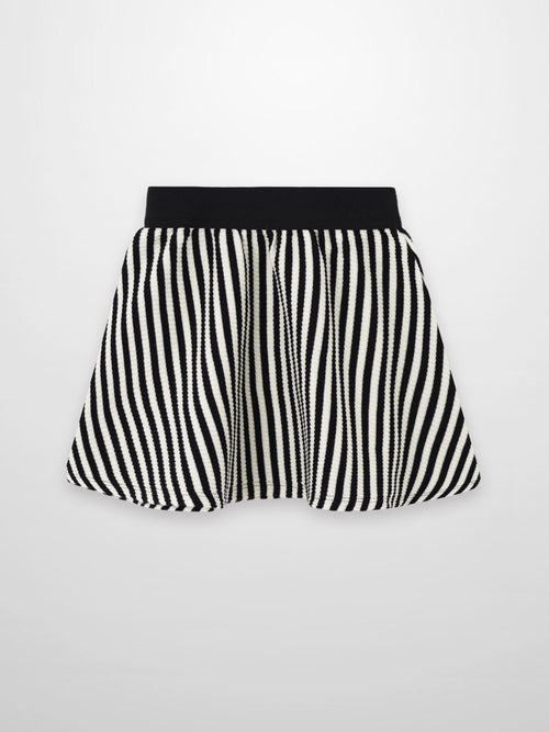 Striped black-and-white circle skirt for girls with a wide black elastic waistband and textured ribbed fabric.