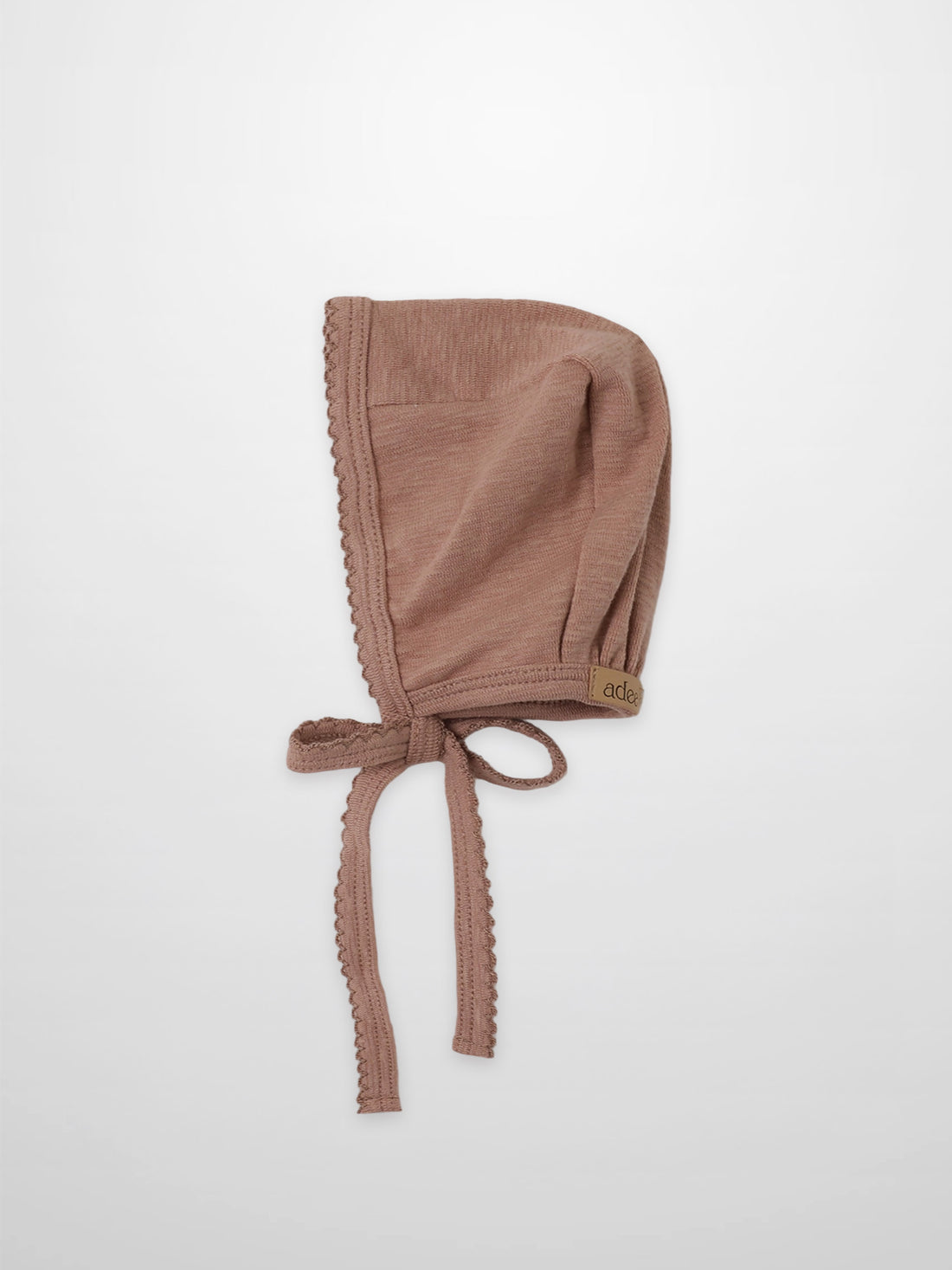 Pink dusty scalloped bonnet for girls by Adee with tie ribbons.