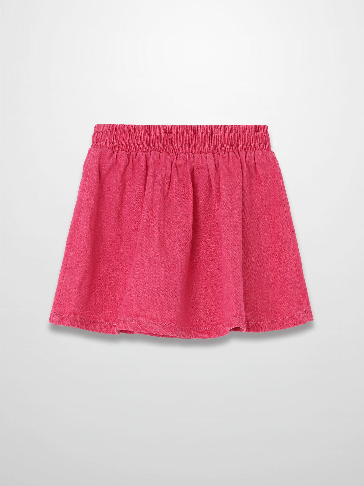Paneled pink denim skirt with elastic waistband.
