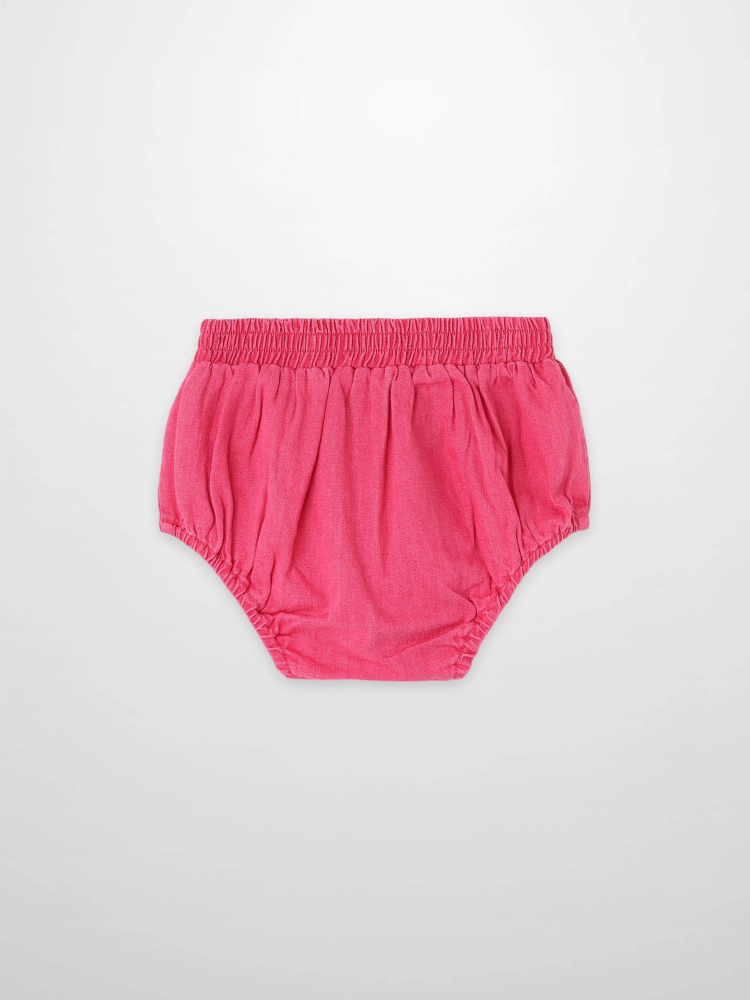 Paneled Bloomers in pink denim with elastic waistband and gathered leg openings.