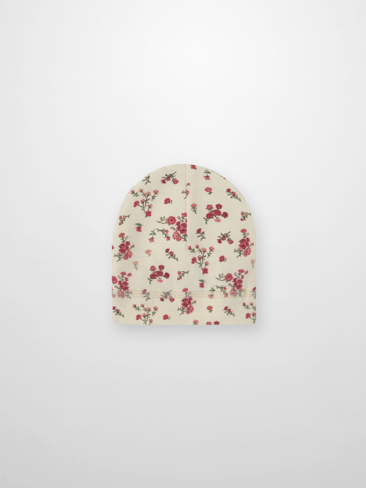 baby beanie hat with pink and red roses with a off white background