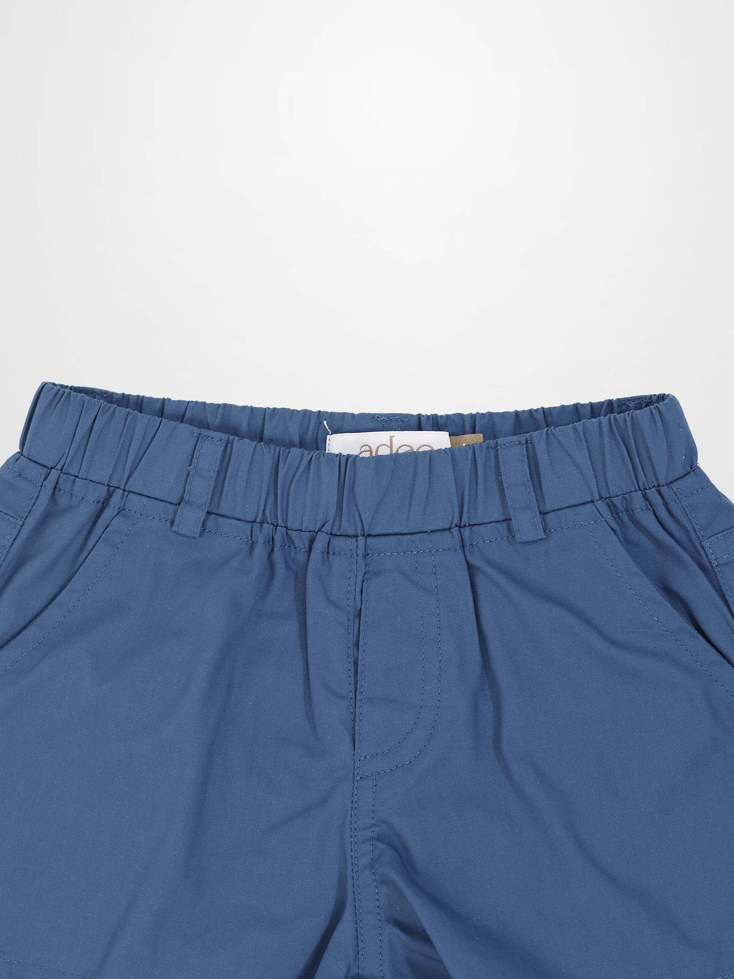 Blue cotton shorts with an elastic waistband and belt loops.