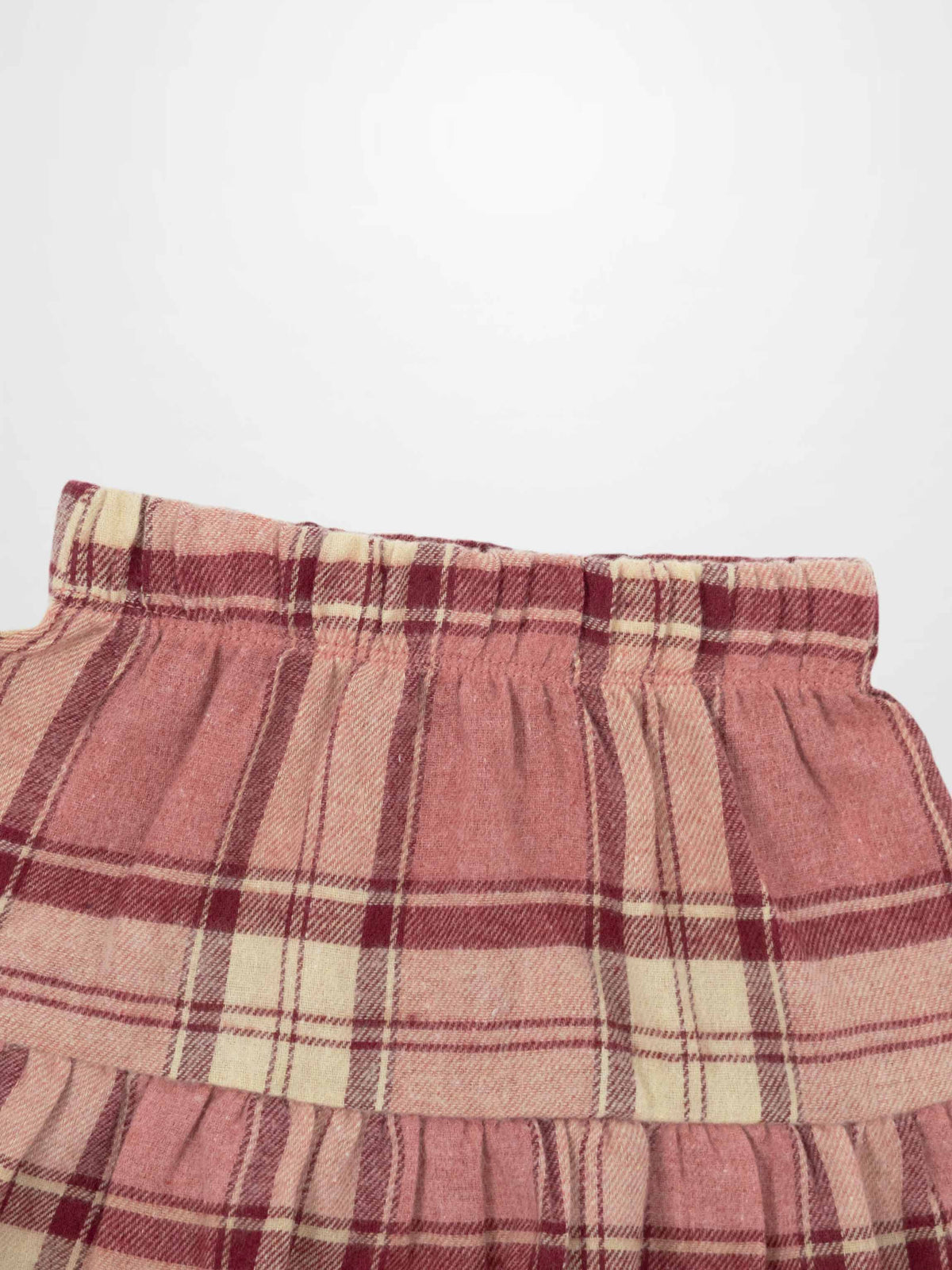 Plaid Pink Girls Dressy Skirt with elastic waistband and pink-red plaid pattern.