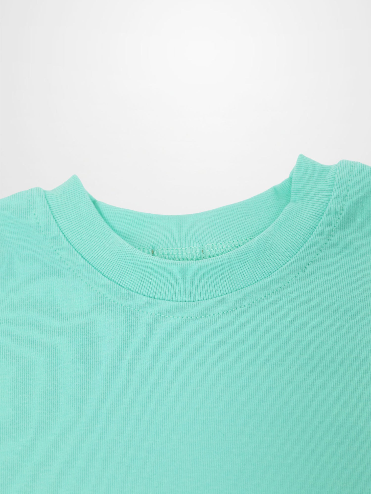 Short-sleeve boxy T-shirt for little boys in mint green.