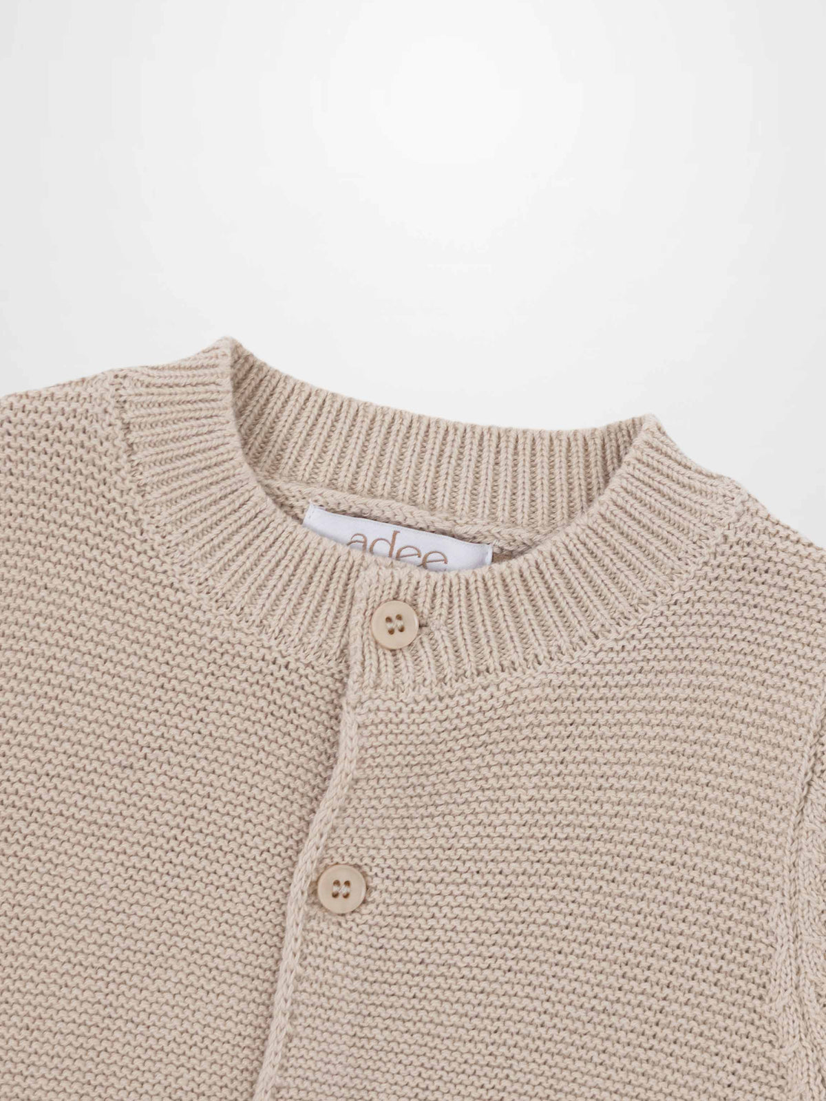 Knit cardigan tan by Adee; unisex dressy top with button-front placket.