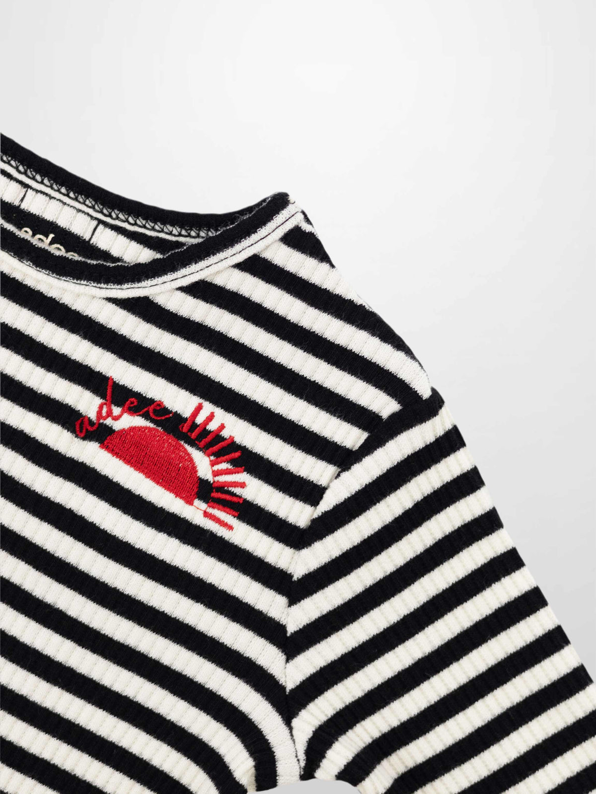 Striped crew neck T-shirt for girls by Adee in black and white ribbed fabric with red sun embroidery