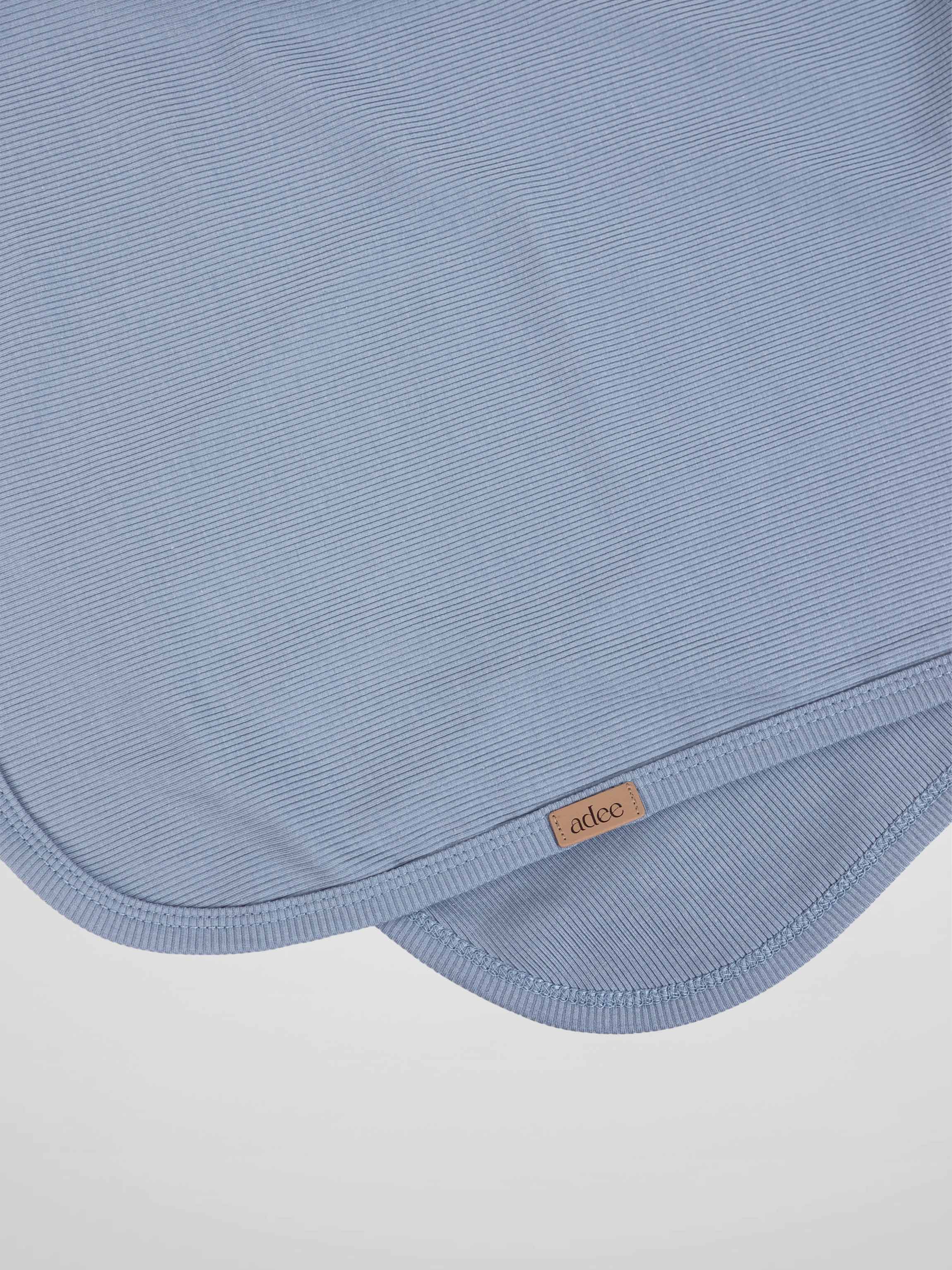 Thin ribbed blue blanket by Adee; boys swaddle blanket with edge tag