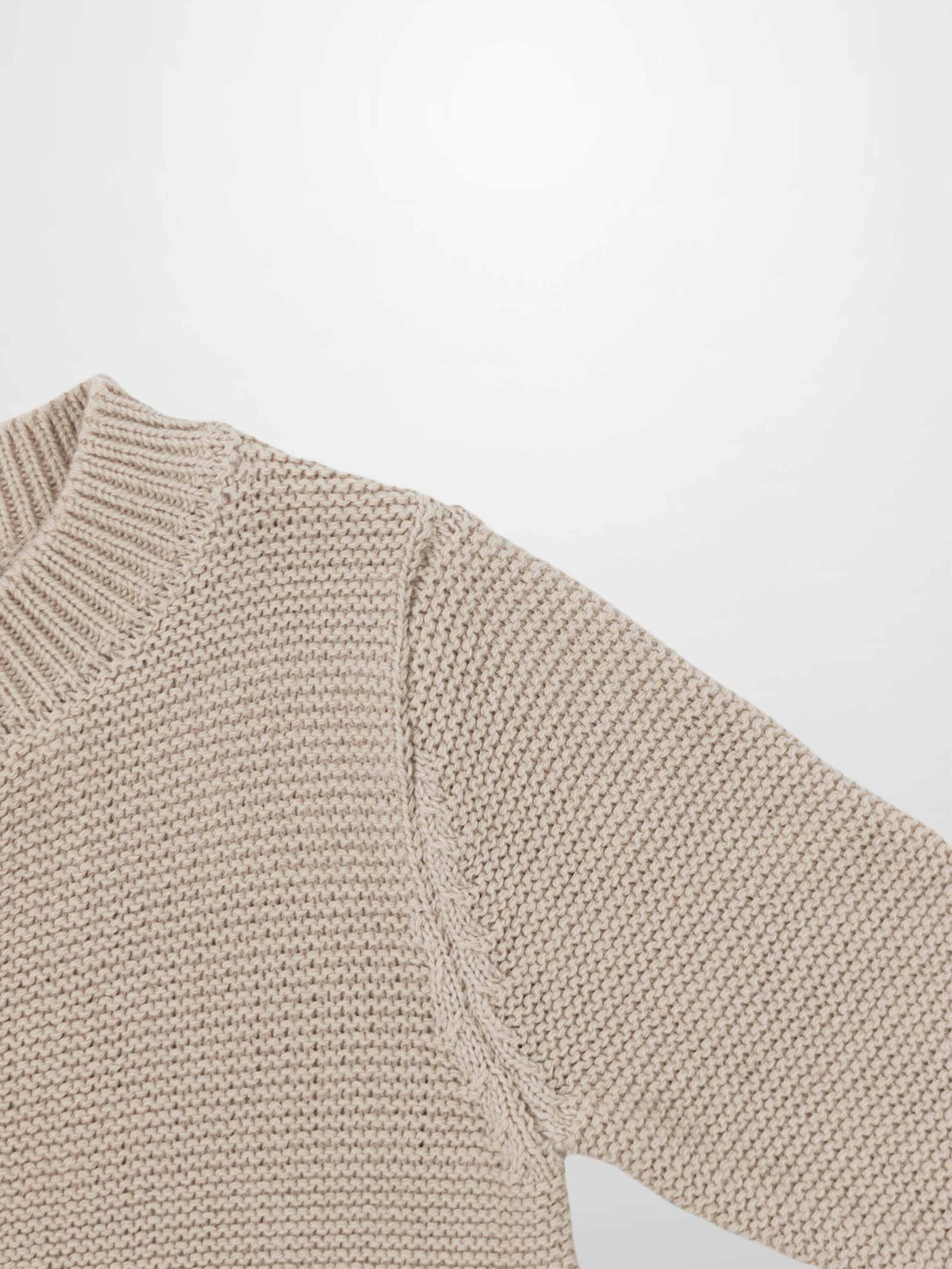 Adee Knit Cardigan in tan; unisex dressy top with chunky knit texture and ribbed collar, shoulder close-up view