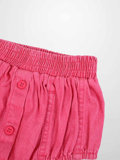 Paneled Bloomers in pink denim with elastic waistband and pink buttons.