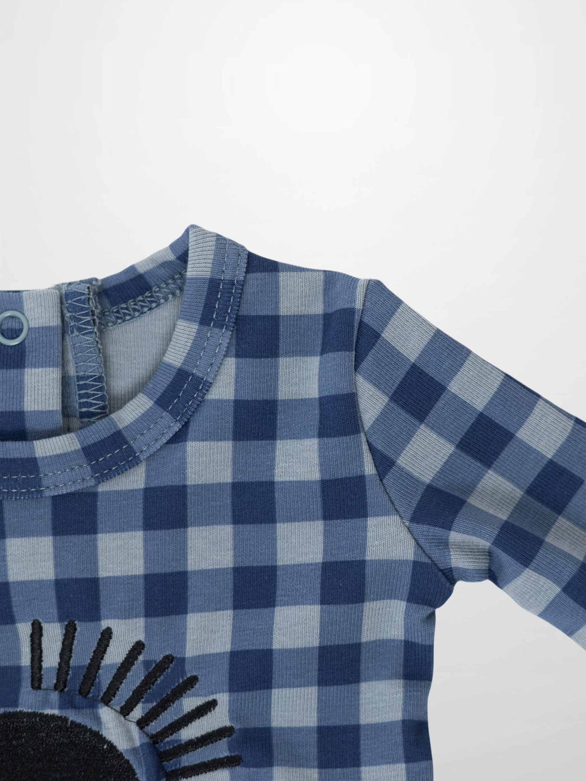 Blue gingham baby footie with sun embroidery, back snaps, and hidden inseam zipper.