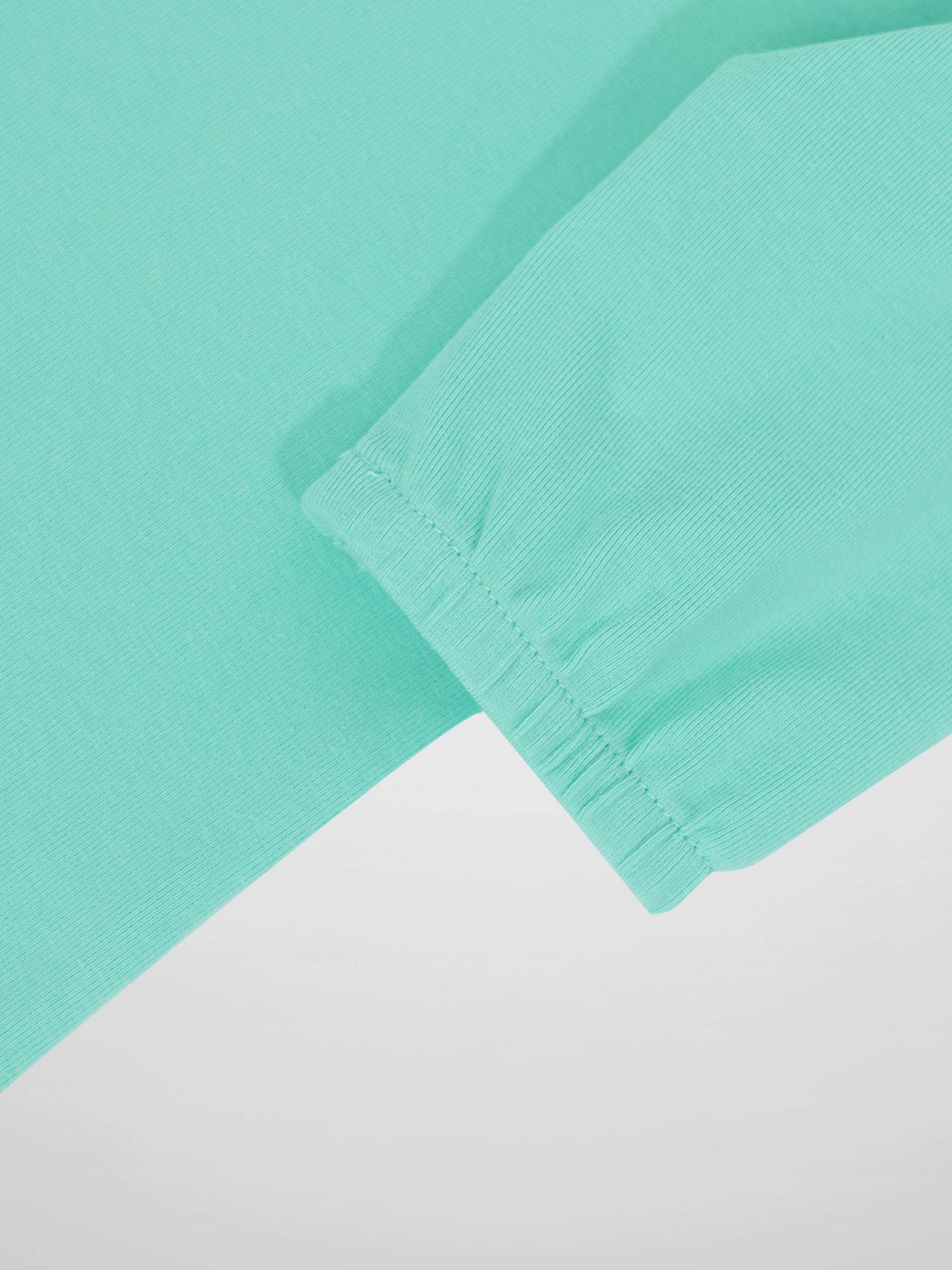 Mint green 3/4 puff sleeve T-shirt cuff detail
