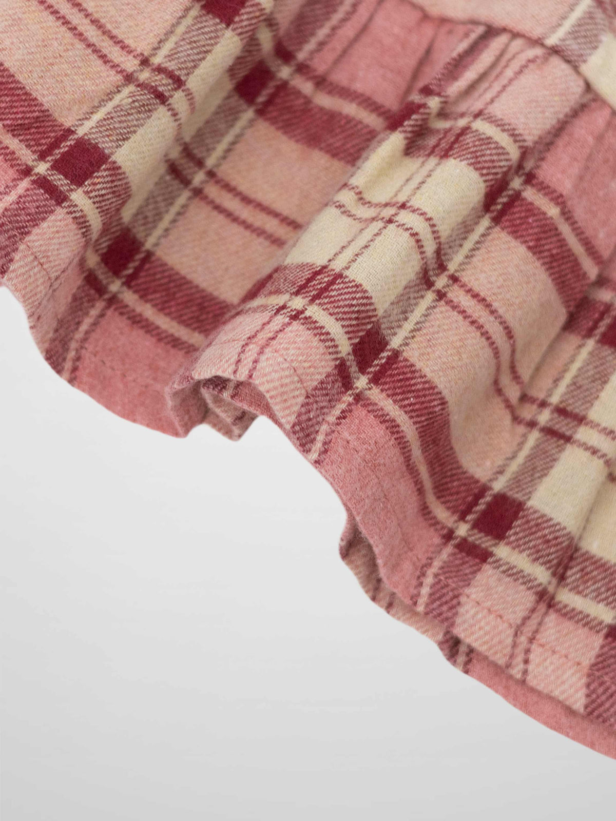 Plaid pink skirt for girls by Adee; dressy apparel in pink and deep red plaid.