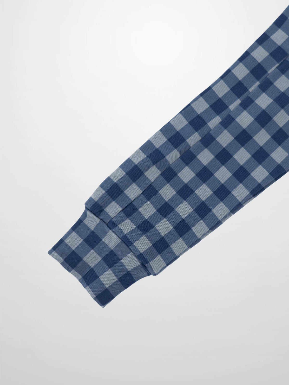 Blue gingham pajama sleeve with ribbed cuff.